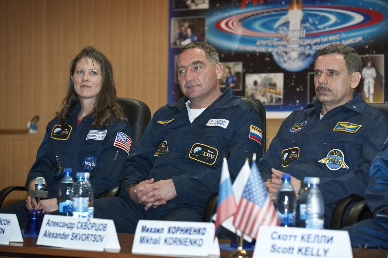 Expedition 23 crew members, from left, NASA’s Tracy Caldwell Dyson, Russian Alexander Skvortsov and Russian Mikhail Kornienko are seen during a press conference held at the Cosmonaut Hotel in Baikonur, Kazakhstan, Thursday, April 1, 2010. The launch of the Soyuz spacecraft with Expedition 23 NASA Flight Engineer Tracy Caldwell Dyson, Soyuz Commander Alexander Skvortsov and Flight Engineer Mikhail Kornienko is scheduled for Friday, April 2, 2010 at 10:04 a.m. Kazakhstan time.  Photo Credit: (NASA/Bill Ingalls)