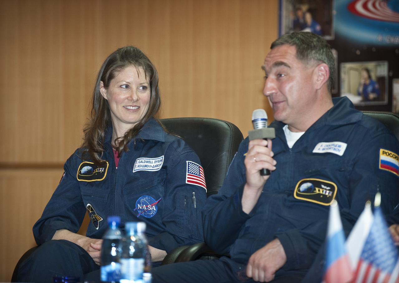 NASA's Tracy Caldwell Dyson, left, looks on as Expedition 23 Soyuz Commander Alexander Skvortsov answers a reporters' question during a press conference held at the Cosmonaut Hotel in Baikonur, Kazakhstan on Thursday, April 1, 2010.  The launch of the Soyuz spacecraft with Expedition 23 NASA Flight Engineer Tracy Caldwell Dyson, Soyuz Commander Alexander Skvortsov and Flight Engineer Mikhail Kornienko is scheduled for Friday, April 2, 2010 at 10:04 a.m. Kazakhstan time.  Photo Credit: (NASA/Bill Ingalls)