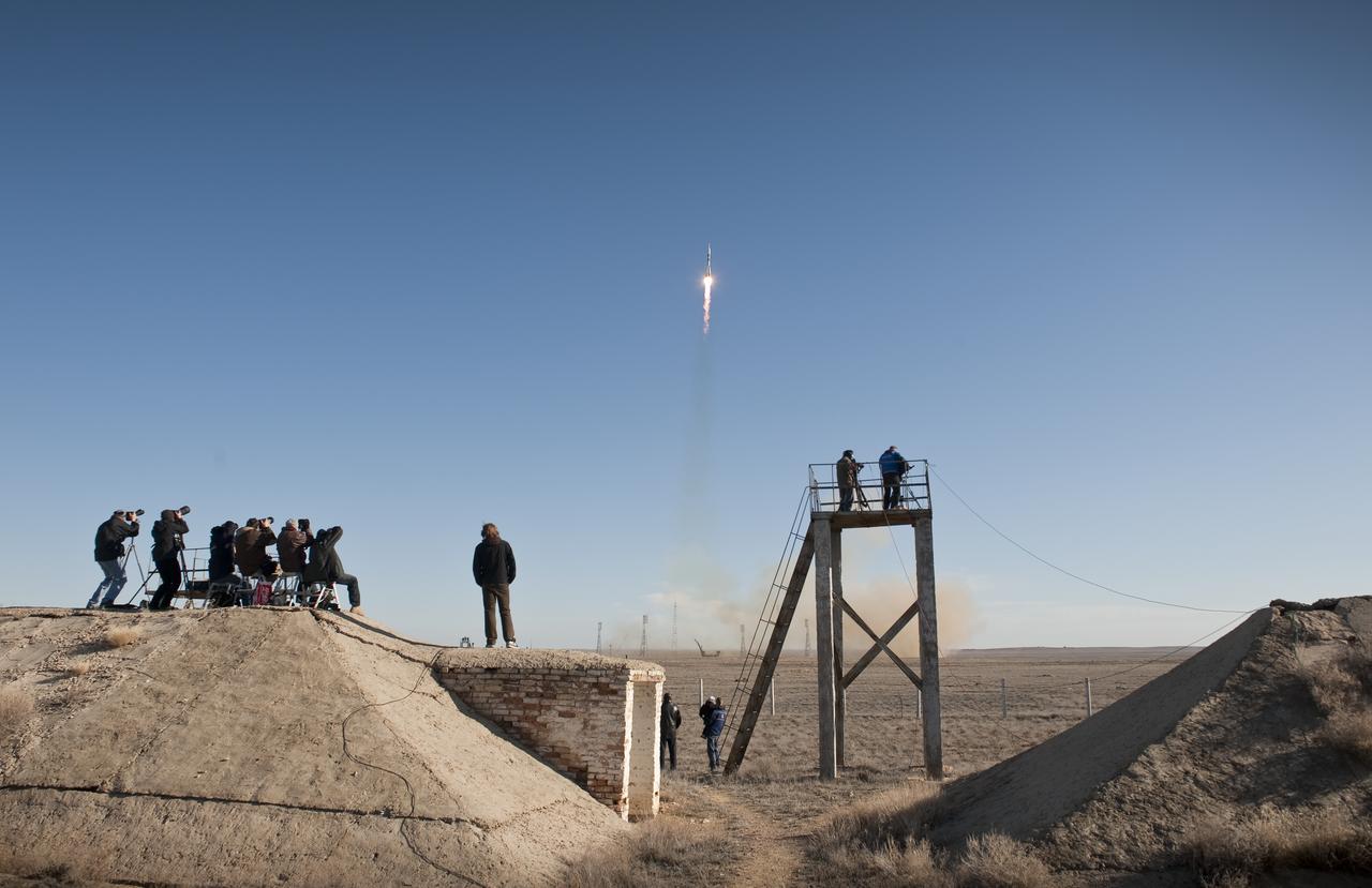 Photographers capture the Soyuz TMA-18 rocket as it launches from the Baikonur Cosmodrome in Kazakhstan on Friday, April 2, 2010 carrying Expedition 23 Soyuz Commander Alexander Skvortsov of Russia, Flight Engineer Mikhail Kornienko of Russia and NASA Flight Engineer Tracy Caldwell Dyson of the U.S. to the International Space Station. (Photo Credit: NASA/Bill Ingalls)