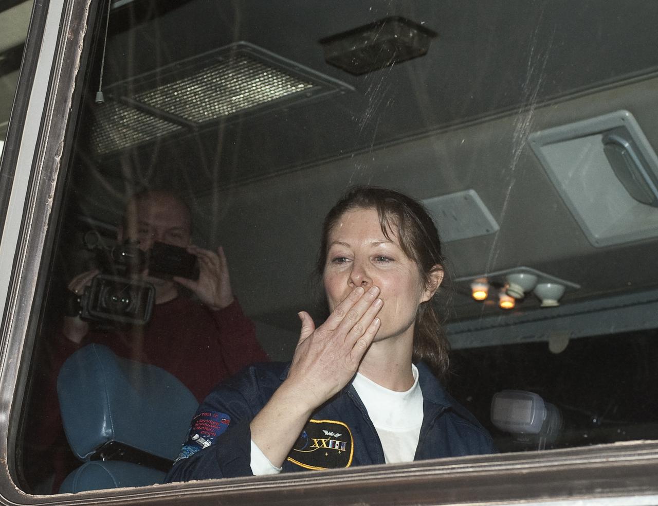 Expedition 23 Flight Engineer Tracy Caldwell Dyson waves farewell to well wishers as she departs the Cosmonaut Hotel on the morning of the Soyuz launch to the International Space Station on Friday, April 2, 2010 in Baikonur, Kazakhstan.  Photo Credit: (NASA/Carla Cioffi)