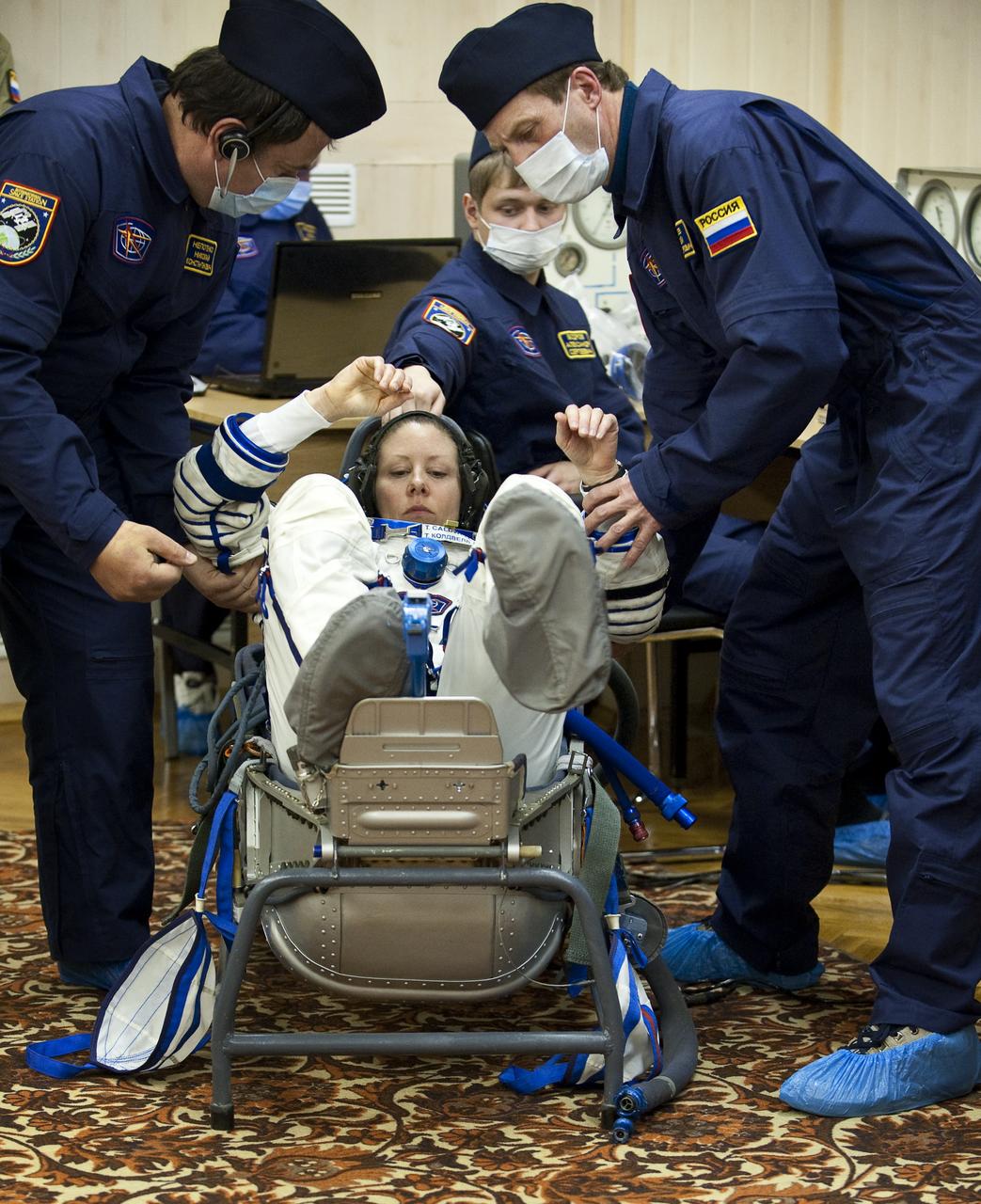 Expedition 23 NASA Flight Engineer Tracy Caldwell Dyson of the U.S. prepares to have her Russian Sokol suit pressure checked at the Baikonur Cosmodrome in Baikonur, Kazakhstan, Friday, April 2, 2010. Caldwell Dyson and fellow Expedition 23 crewmembers Soyuz Commander Alexander Skvortsov and Flight Engineer Mikhail Kornienko of Russia launched in their Soyuz TMA-18 rocket from the Baikonur Cosmodrome in Kazakhstan on Friday, April 2, 2010. Photo Credit: (NASA/Carla Cioffi)