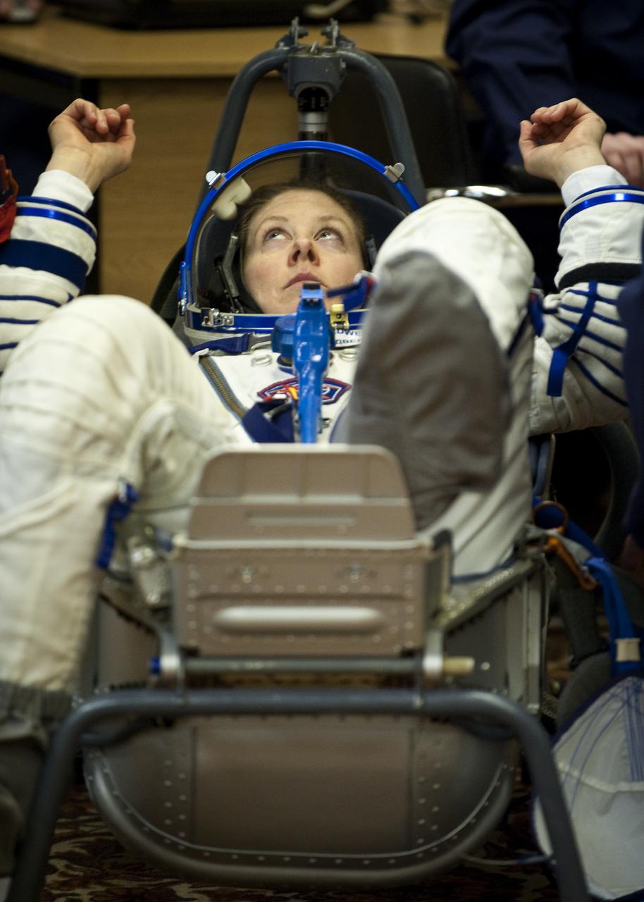 Expedition 23 NASA Flight Engineer Tracy Caldwell Dyson of the U.S. prepares to have her Russian Sokol suit pressure checked at the Baikonur Cosmodrome in Baikonur, Kazakhstan, Friday, April 2, 2010. Caldwell Dyson and fellow Expedition 23 crewmembers Soyuz Commander Alexander Skvortsov and Flight Engineer Mikhail Kornienko of Russia launched in their Soyuz TMA-18 rocket from the Baikonur Cosmodrome in Kazakhstan on Friday, April 2, 2010. Photo Credit: (NASA/Carla Cioffi)