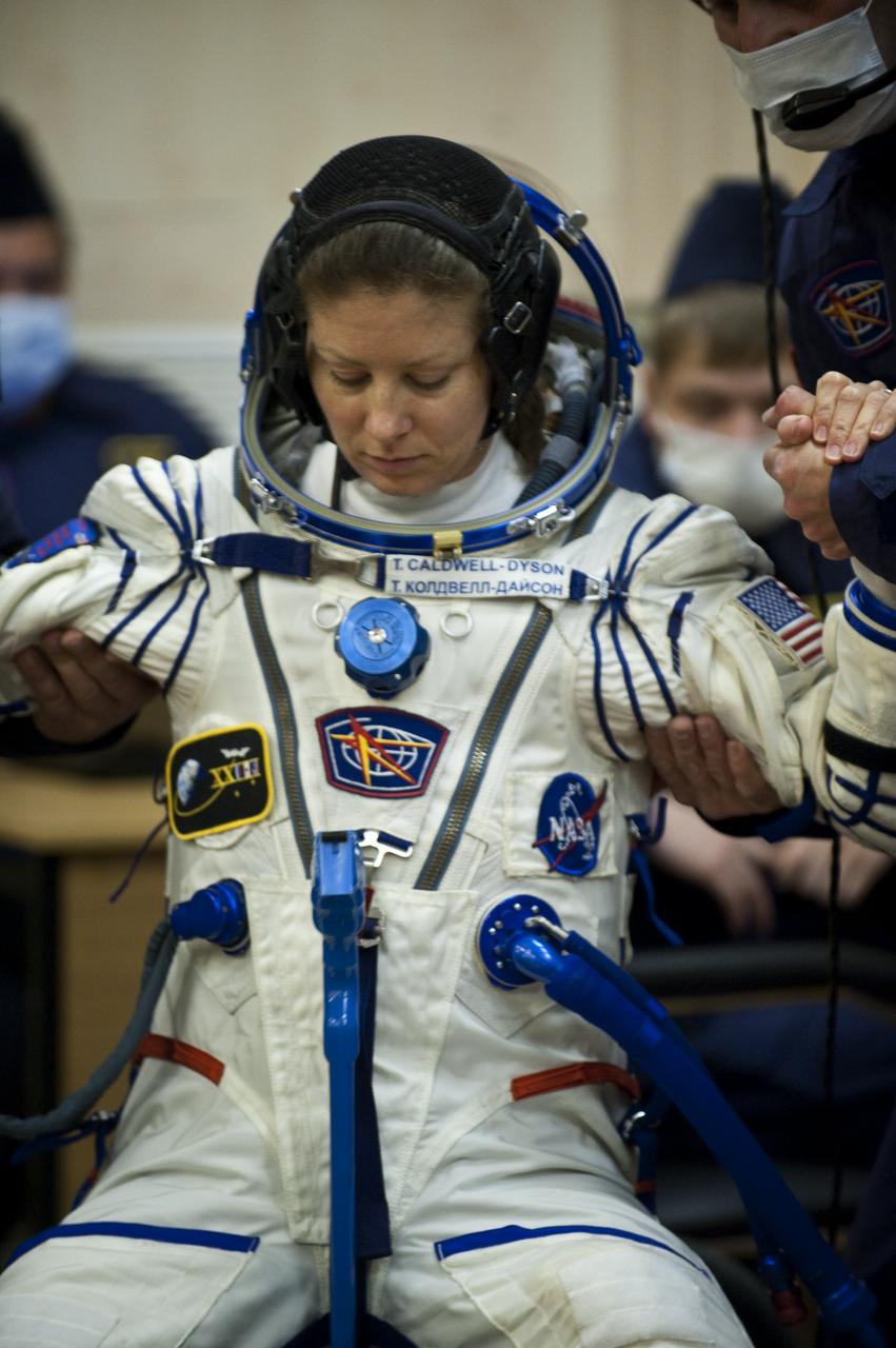 Expedition 23 NASA Flight Engineer Tracy Caldwell Dyson of the U.S. prepares to have her Russian Sokol suit pressure checked at the Baikonur Cosmodrome in Baikonur, Kazakhstan, Friday, April 2, 2010. Caldwell Dyson and fellow Expedition 23 crewmembers Soyuz Commander Alexander Skvortsov and Flight Engineer Mikhail Kornienko of Russia launched in their Soyuz TMA-18 rocket from the Baikonur Cosmodrome in Kazakhstan on Friday, April 2, 2010. Photo Credit: (NASA/Carla Cioffi)