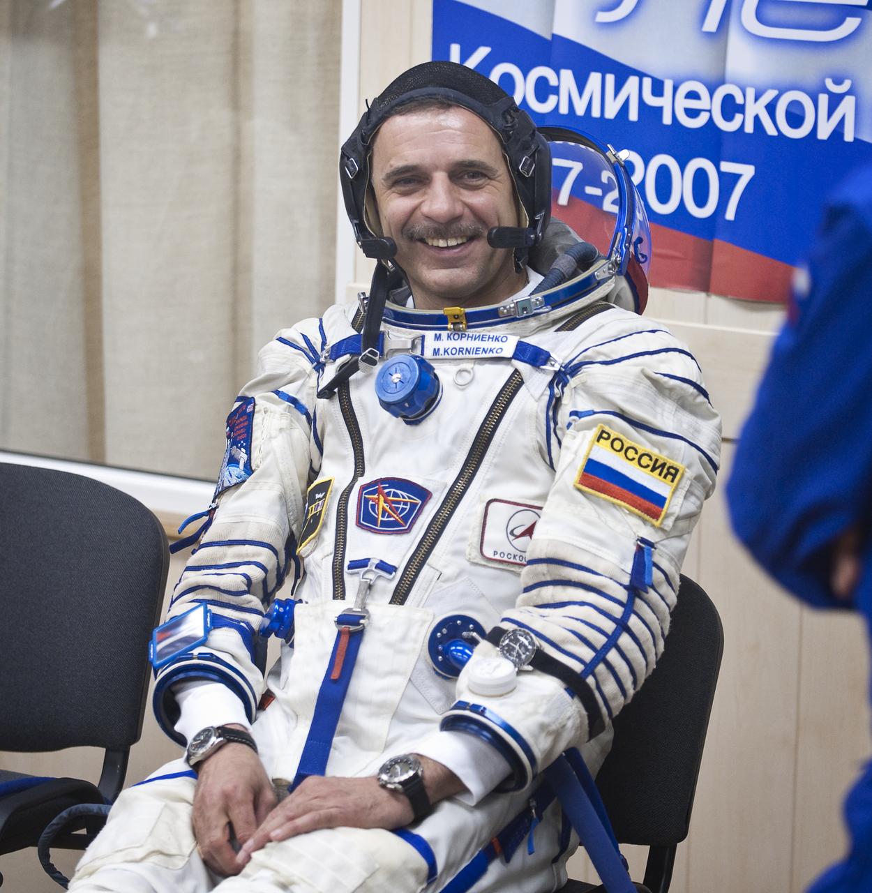 Russian cosmonaut Expedition 23 Flight Engineer Mikhail Kornienko smiles as he awaits to have his Sokol suit pressure checked prior to launch, Friday, April 2, 2010, in Baikonur, Kazakhstan.  Kornienko and fellow Expedition 23 crew members Soyuz Commander Alexander Skvortsov and NASA Flight Engineer Tracy Caldwell Dyson launched in their Soyuz TMA-18 rocket from the Baikonur Cosmodrome in Kazakhstan on Friday, April 2, 2010. Photo Credit:  (NASA/Bill Ingalls)