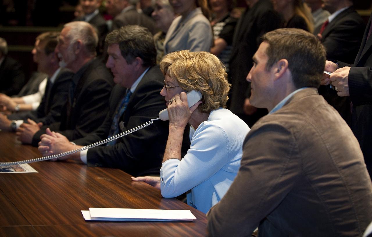Mary Ellen Caldwell, center, speaks to her daughter NASA Flight Engineer Tracy Caldwell Dyson onboard the International Space Station from the Russian Mission Control Center, Korolev, Russia, Sunday, April 4, 2010. The Soyuz TMA-18 docked to the International Space Station carrying Expedition 23 Soyuz Commander Alexander Skvortsov, Flight Engineer Mikhail Kornienko and NASA Flight Engineer Tracy Caldwell Dyson.  Photo Credit: (NASA/Carla Cioffi) 