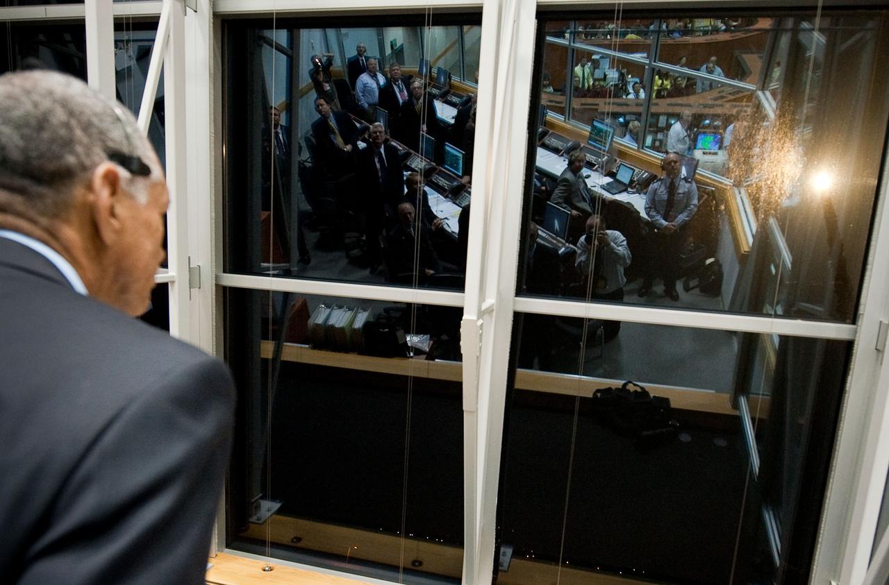 201004050001hq (5 April 2010) --- NASA Administrator Charles Bolden looks out the window of Firing Room Four in the Launch Control Center during the launch of the space shuttle Discovery and the start of the STS-131 mission at NASA Kennedy Space Center in Cape Canaveral, Fla. on April 5, 2010. Discovery is carrying a multi-purpose logistics module filled with science racks for the laboratories aboard the International Space Station. The mission has three planned spacewalks, with work to include replacing an ammonia tank assembly, retrieving a Japanese experiment from the station?s exterior, and switching out a rate gyro assembly on the station?s truss structure. Photo Credit: NASA/Bill Ingalls