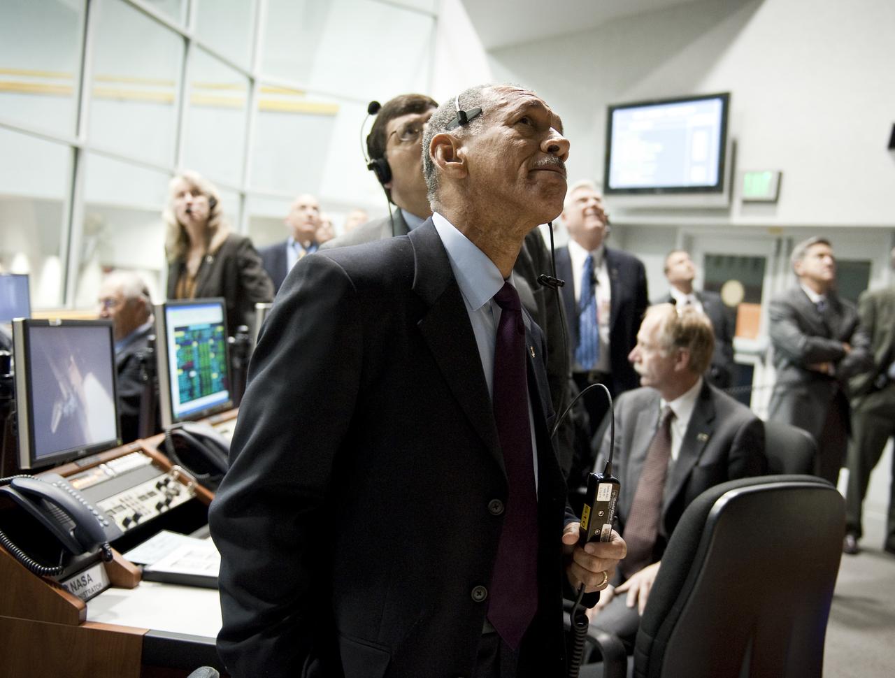 NASA Administrator Charles Bolden looks out the window of Firing Room Four in the Launch Control Center during the launch of the space shuttle Discovery and the start of the STS-131 mission at NASA Kennedy Space Center in Cape Canaveral, Fla. on Monday April 5, 2010. Discovery is carrying a multi-purpose logistics module filled with science racks for the laboratories aboard the station. The mission has three planned spacewalks, with work to include replacing an ammonia tank assembly, retrieving a Japanese experiment from the station’s exterior, and switching out a rate gyro assembly on the station’s truss structure. Photo Credit: (NASA/Bill Ingalls)