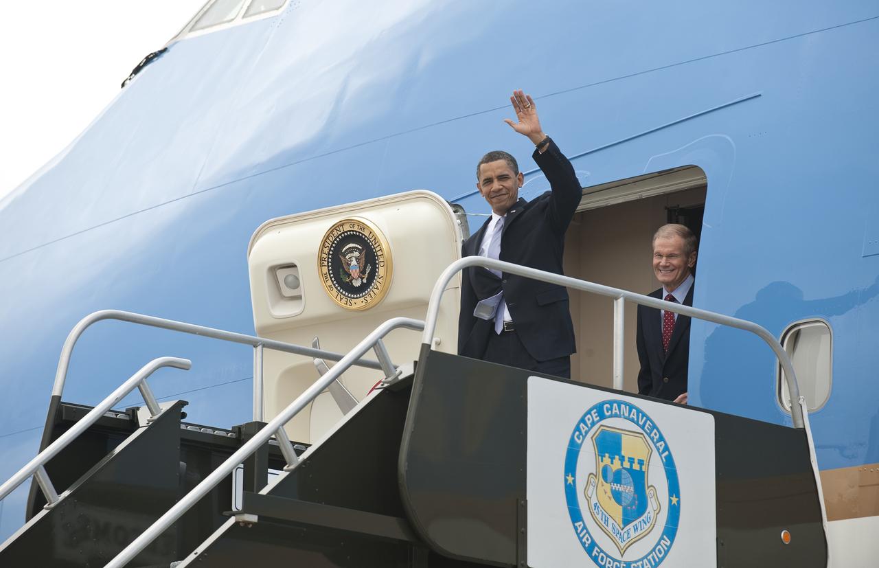 President Barack Obama waves hello as he exits of Air Force One along with Senator Bill Nelson after landing at the NASA Kennedy Space Center in Cape Canaveral, Fla. on Thursday, April 15, 2010. Obama visited Kennedy to deliver remarks on the bold new course the administration is charting to maintain U.S. leadership in human space flight. Photo Credit: (NASA/Bill Ingalls)