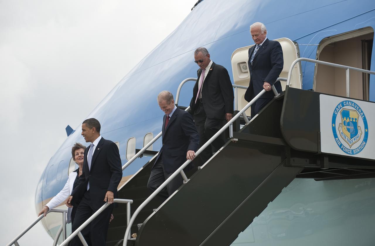 President Barack Obama, left, exits of Air Force One with, from left, Representative US Representative Suzanne M. Kosmas (D - FL), U.S Senator Bill Nelson (D-FL), NASA Administrator Charles Bolden, and Apollo 11 Astronaut Buzz Aldrin after landing at the NASA Kennedy Space Center in Cape Canaveral, Fla. on Thursday, April 15, 2010. Obama visited Kennedy to deliver remarks on the bold new course the administration is charting to maintain U.S. leadership in human space flight. Photo Credit: (NASA/Bill Ingalls)