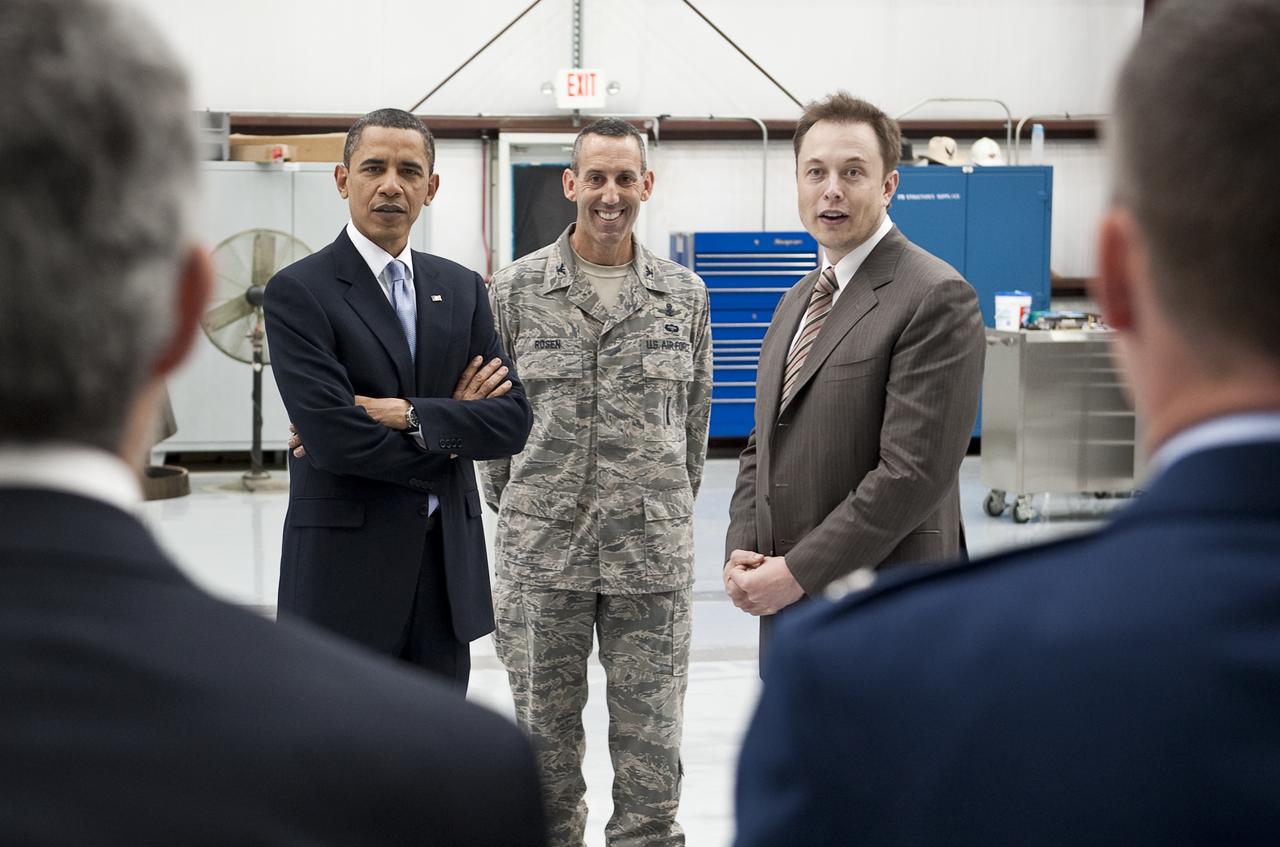 President Barack Obama, left, Air Force Col. Lee Rosen, Commander, 45th Launch Group, center, and SpaceX CEO Elon Musk talk with Dr. John P. Holdren is Assistant to the President for Science and Technology during a tour of the commercial rocket processing facility of Space Exploration Technologies, known as SpaceX, at Cape Canaveral Air Force Station, Cape Canaveral, Fla. on Thursday, April 15, 2010. Obama also visited the NASA Kennedy Space Center to deliver remarks on the bold new course the administration is charting to maintain U.S. leadership in human space flight. Photo Credit: (NASA/Bill Ingalls)
