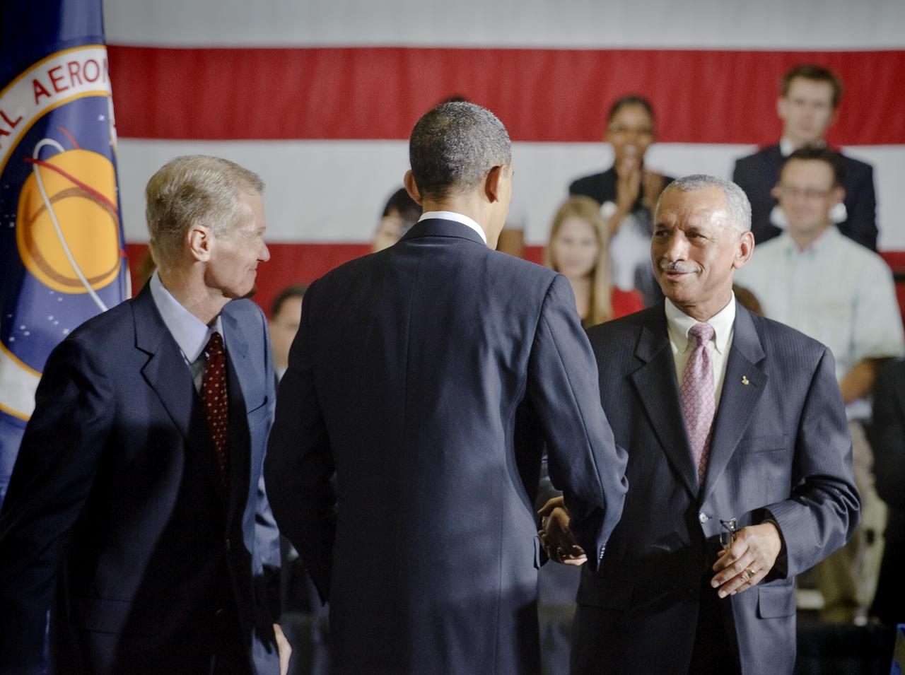 President Barack Obama, center, back to camera, shakes hands with NASA Administrator Charles Bolden, right, as U.S. Sen. Bill Nelson, D-Fla., looks on prior to Obama's speech outlining the bold new course the administration is charting to maintain U.S. leadership in human space flight at the NASA Kennedy Space Center in Cape Canaveral, Fla. on Thursday, April 15, 2010. Photo Credit: (NASA/Paul E. Alers)