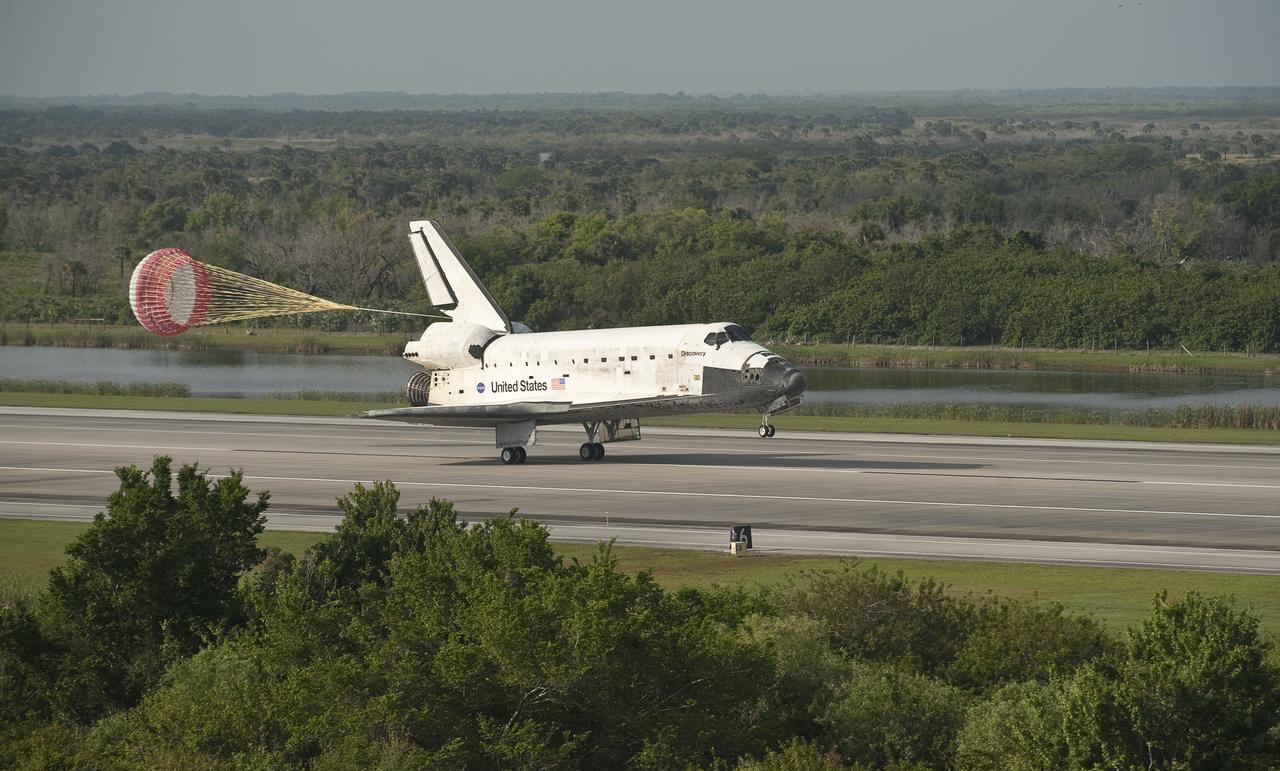 The space shuttle Discovery is seen as it lands at the Kennedy Space Center in Cape Canaveral, Florida, Tuesday, April 20, 2010. Discovery and the STS-131 mission crew, Commander Alan G. Poindexter, Pilot James P. Dutton Jr. and Mission Specialists Dorothy Metcalf-Lindenburger, Rick Mastracchio, Stephanie Wilson, Clayton Anderson and Japanese astronaut Naoko Yamazaki returned from their mission to the International Space Station.  Photo credit: (NASA/Bill Ingalls)