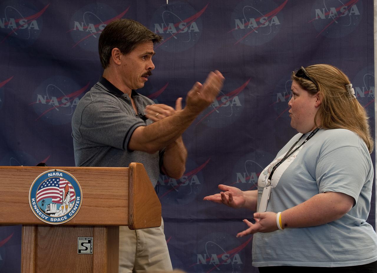 Jon Cowart @Rocky_Sci, orbiter engineering manager, Space Shuttle Program, interacts with Tweetup participant,  Jen Vargas, @jenvargus, as he speaks to participants at the two-day STS-132 Launch Tweetup at Kennedy Space Center, Thursday, May 13, 2010, in Cape Canaveral, Fla.  NASA Twitter followers in attendance will have the opportunity to take a tour of NASA's Kennedy Space Center, view the space shuttle launch and speak with shuttle technicians, engineers, astronauts and managers. Photo Credit: (NASA/Paul E. Alers)