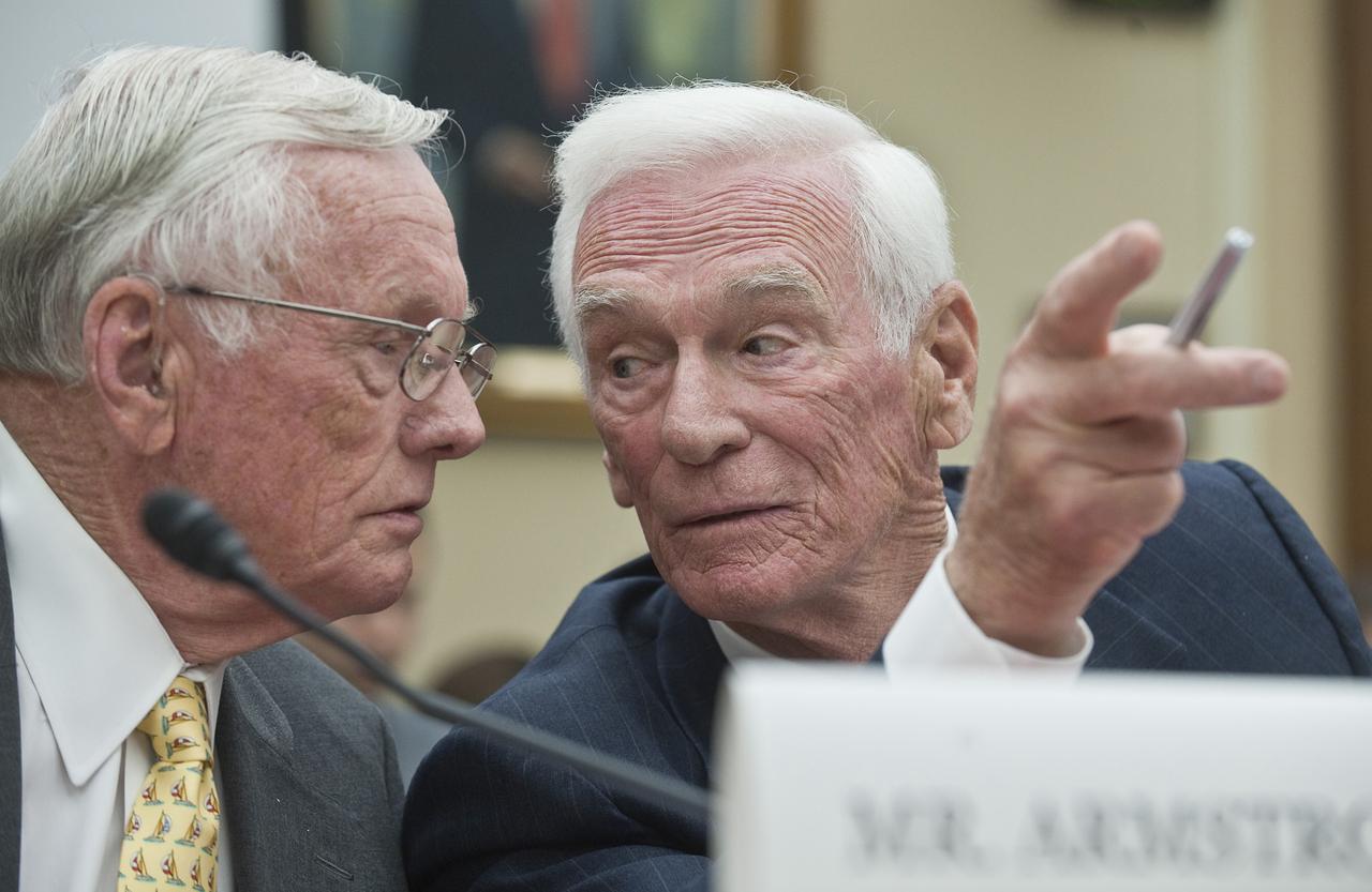 Apollo 11 Commander Neil Armstrong, left, and retired Navy Captain and commander of Apollo 17 Eugene Cernana, confer prior to testifying at a hearing before the House Science and Technology Committee, Tuesday, May 26, 2010, at the Rayburn House office building on Capitol Hill in Washington. The hearing was to review proposed human spaceflight plan by NASA. Photo Credit: (NASA/Paul E. Alers)