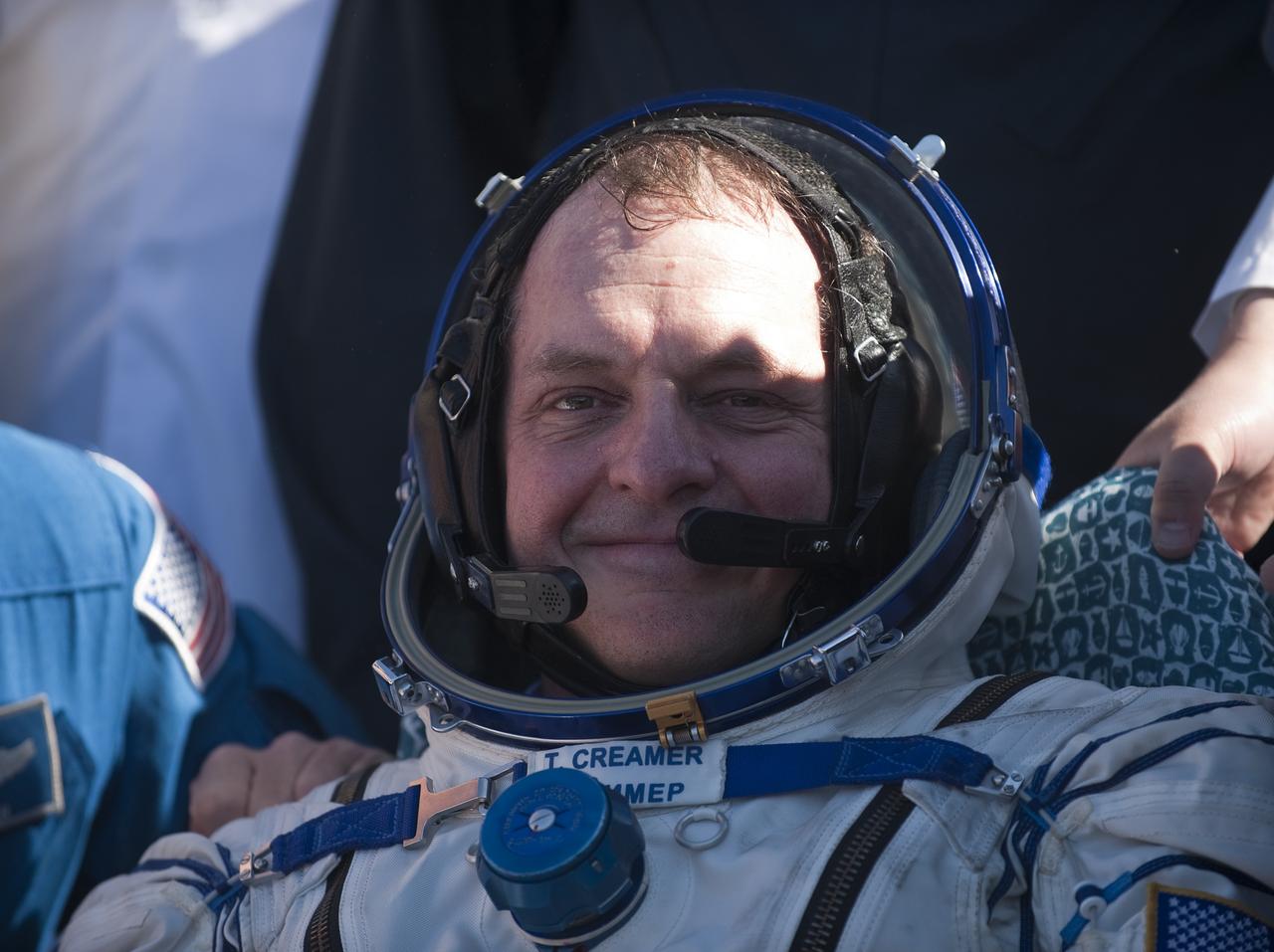 Expedition 23 Flight Engineer T.J. Creamer is seen sitting in a chair outside the Soyuz Capsule just minutes after he and fellow crew members Soichi Noguchi and Commander Oleg Kotov landed in their Soyuz TMA-17 capsule near the town of Zhezkazgan, Kazakhstan on Wednesday, June 2, 2010. NASA Astronaut Creamer, Russian Cosmonaut Kotov and Japanese Astronaut Noguchi are returning from six months onboard the International Space Station where they served as members of the Expedition 22 and 23 crews. Photo Credit: (NASA/Bill Ingalls)
