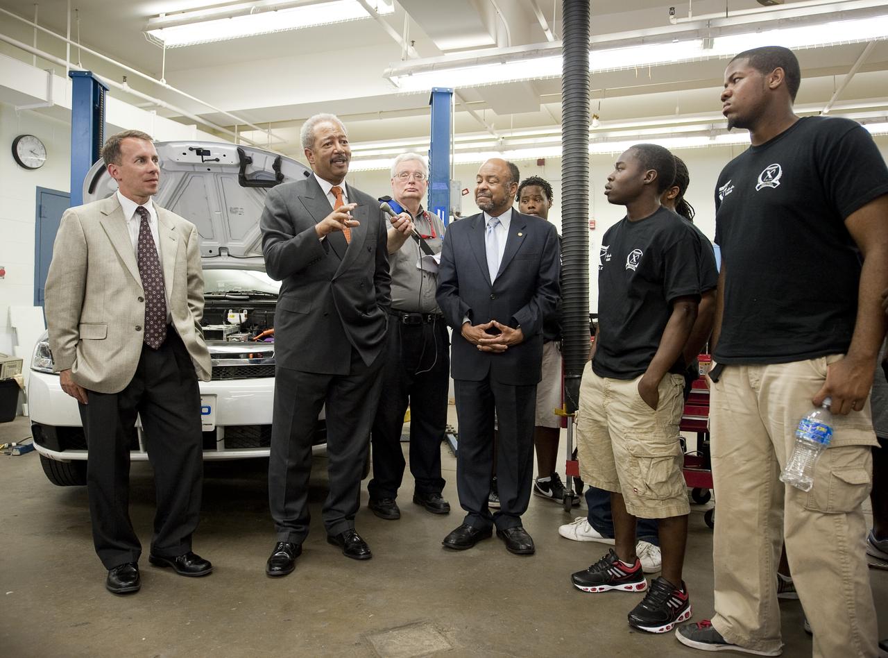 NASA Chief Technologist Bobby Braun, left, and Congressman Chaka Fattah (D-PA), center, and Pennsylvania State Representative Jim Roebuck talk with students of the West Philly Hybrid X Team at West Philadelphia High School in Philadelphia, Monday, June 7, 2010.  The prize-winning West Philly Hybrid X Team has drawn international recognition as the only high school among 22 finalists in the Progressive Insurance Automotive X Prize (PIAXP) competition to develop cars that achieve over 100 MPG.  Photo Credit: (NASA/Bill Ingalls)