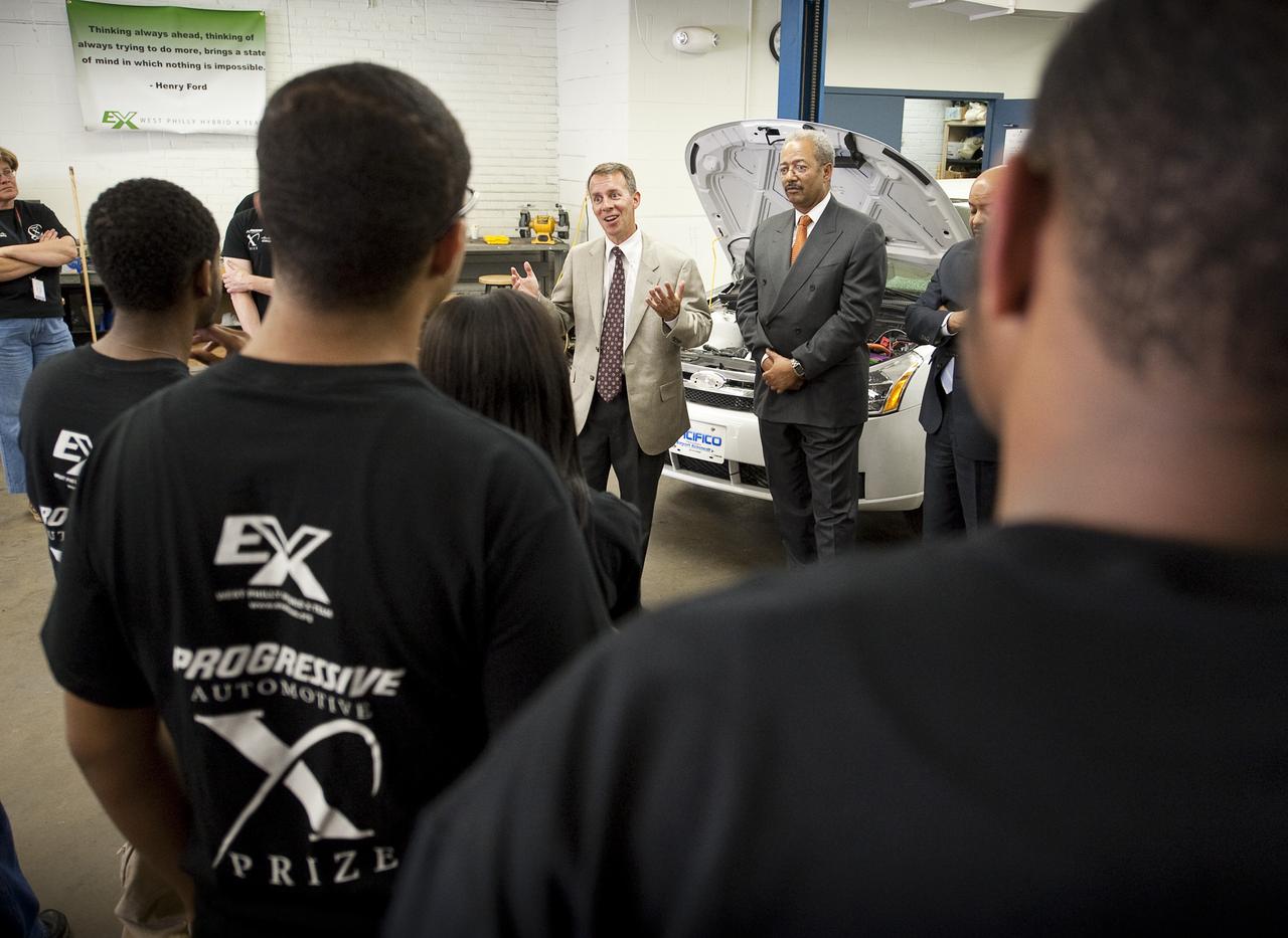 NASA Chief Technologist Bobby Braun, left, and Congressman Chaka Fattah (D-PA), right, talk to student members of the West Philly Hybrid X Team at West Philadelphia High School in Philadelphia, Monday, June 7, 2010.  The prize-winning West Philly Hybrid X Team has drawn international recognition as the only high school among 22 finalists in the Progressive Insurance Automotive X Prize (PIAXP) competition to develop cars that achieve over 100 MPG.  Photo Credit: (NASA/Bill Ingalls)