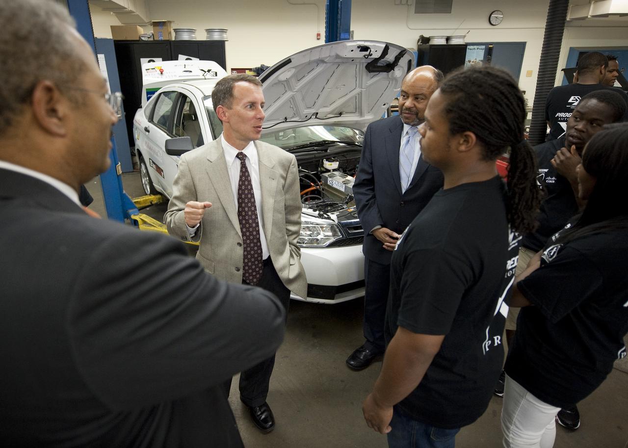 NASA Chief Technologist Bobby Braun, left, and Pennsylvania State Representative Jim Roebuck talk with students of the West Philly Hybrid X Team at West Philadelphia High School in Philadelphia, Monday, June 7, 2010.  The prize-winning West Philly Hybrid X Team has drawn international recognition as the only high school among 22 finalists in the Progressive Insurance Automotive X Prize (PIAXP) competition to develop cars that achieve over 100 MPG.  Photo Credit: (NASA/Bill Ingalls)