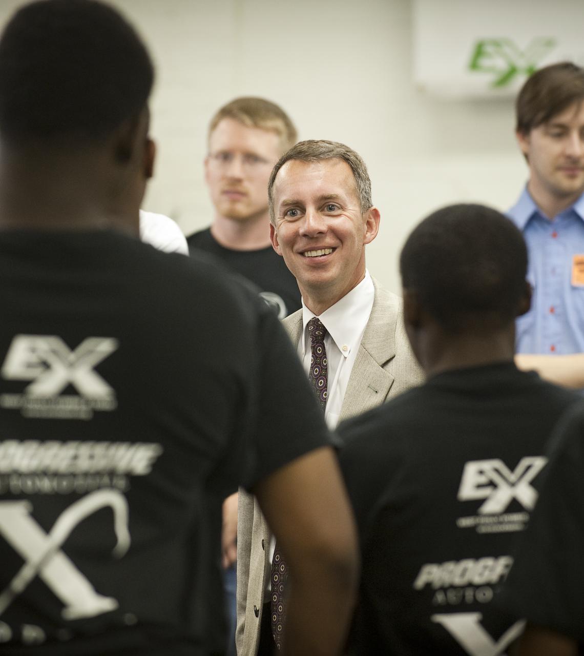 NASA Chief Technologist Bobby Braun talks with student members of the West Philly Hybrid X Team at West Philadelphia High School in Philadelphia, Monday, June 7, 2010.  The prize-winning West Philly Hybrid X Team has drawn international recognition as the only high school among 22 finalists in the Progressive Insurance Automotive X Prize (PIAXP) competition to develop cars that achieve over 100 MPG.  Photo Credit: (NASA/Bill Ingalls)