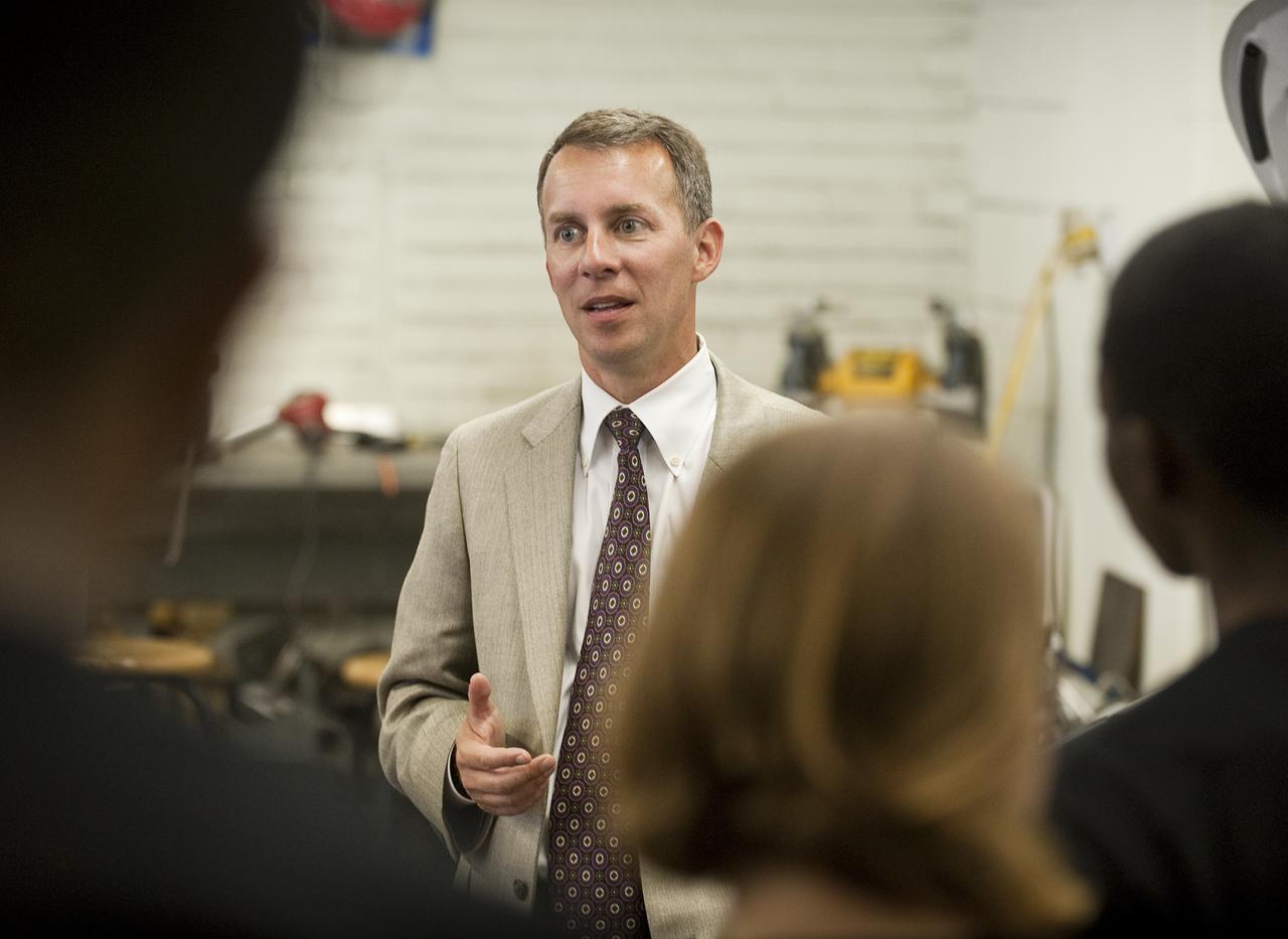 NASA Chief Technologist Bobby Braun talks with student members of the West Philly Hybrid X Team at West Philadelphia High School in Philadelphia, Monday, June 7, 2010.  The prize-winning West Philly Hybrid X Team has drawn international recognition as the only high school among 22 finalists in the Progressive Insurance Automotive X Prize (PIAXP) competition to develop cars that achieve over 100 MPG.  Photo Credit: (NASA/Bill Ingalls)
