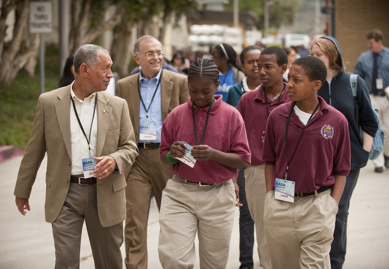 NASA Administrator Charles Bolden, left, and Jet Propulsion Laboratory Director Dr. Charles Elachi lead school students to High Bay One at JPL during the kick off of NASA's Summer of Innovation program at the Jet Propulsion Laboratory in Pasadena, Calif., Thursday, June 10, 2010. Through the program, NASA will engage thousands of middle school students and teachers in stimulating math and science-based education programs with the goal of increasing the number of future scientists, mathematicians, and engineers.  Photo Credit: (NASA/Bill Ingalls)