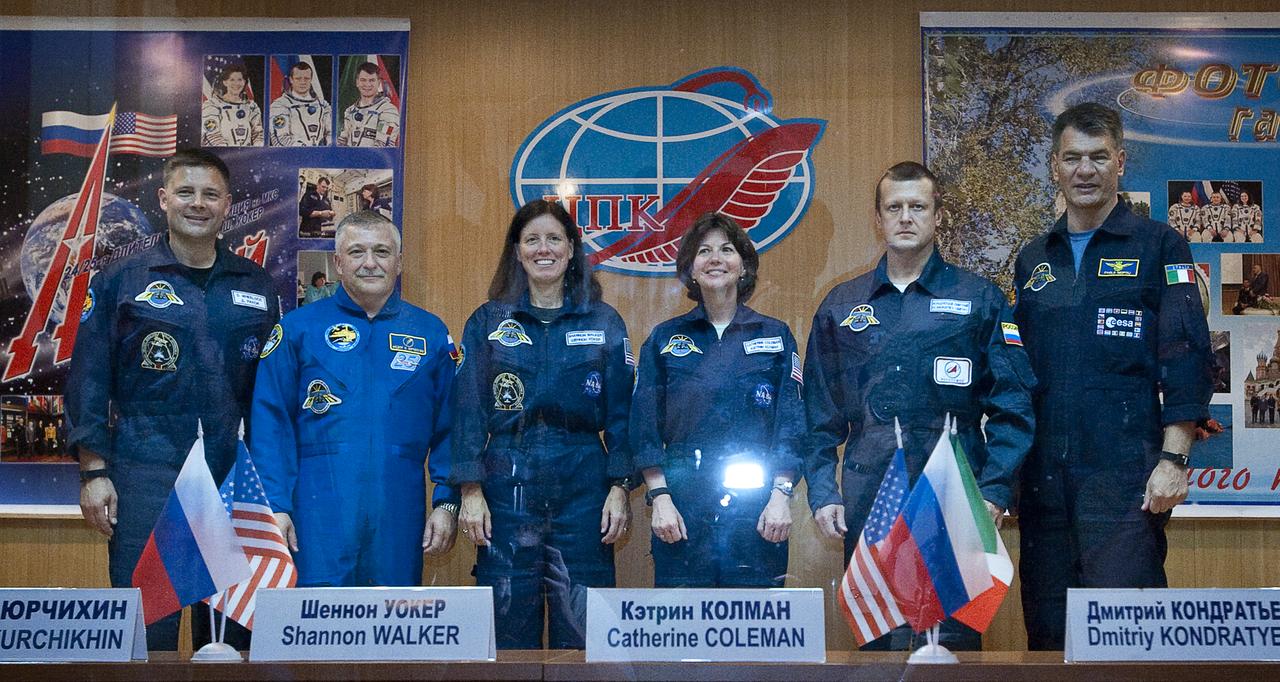 Expedition 24 prime and back-up crew members pose pose for a group photo after a press conference held at the Cosmonaut Hotel in Baikonur, Kazakhstan, Monday, June 14, 2010.  From left: NASA astronaut Doug Wheelock, Russian cosmonaut Fyodor Yurchikhin, NASA astronaut Shannon Walker, NASA astronaut Cady Coleman, Russian cosmonaut Dimitri Kondratiev and European Space Agency Paolo Nespoli of Italy. The launch of the Soyuz spacecraft with Expedition 24 NASA Flight Engineers Shannon Walker and Douglas Wheelock, and Soyuz Commander Fyodor Yurchikhin is scheduled for Wednesday, June 16, 2010 at 3:35 a.m. Kazakhstan time.  Photo Credit: (NASA/Carla Cioffi)
