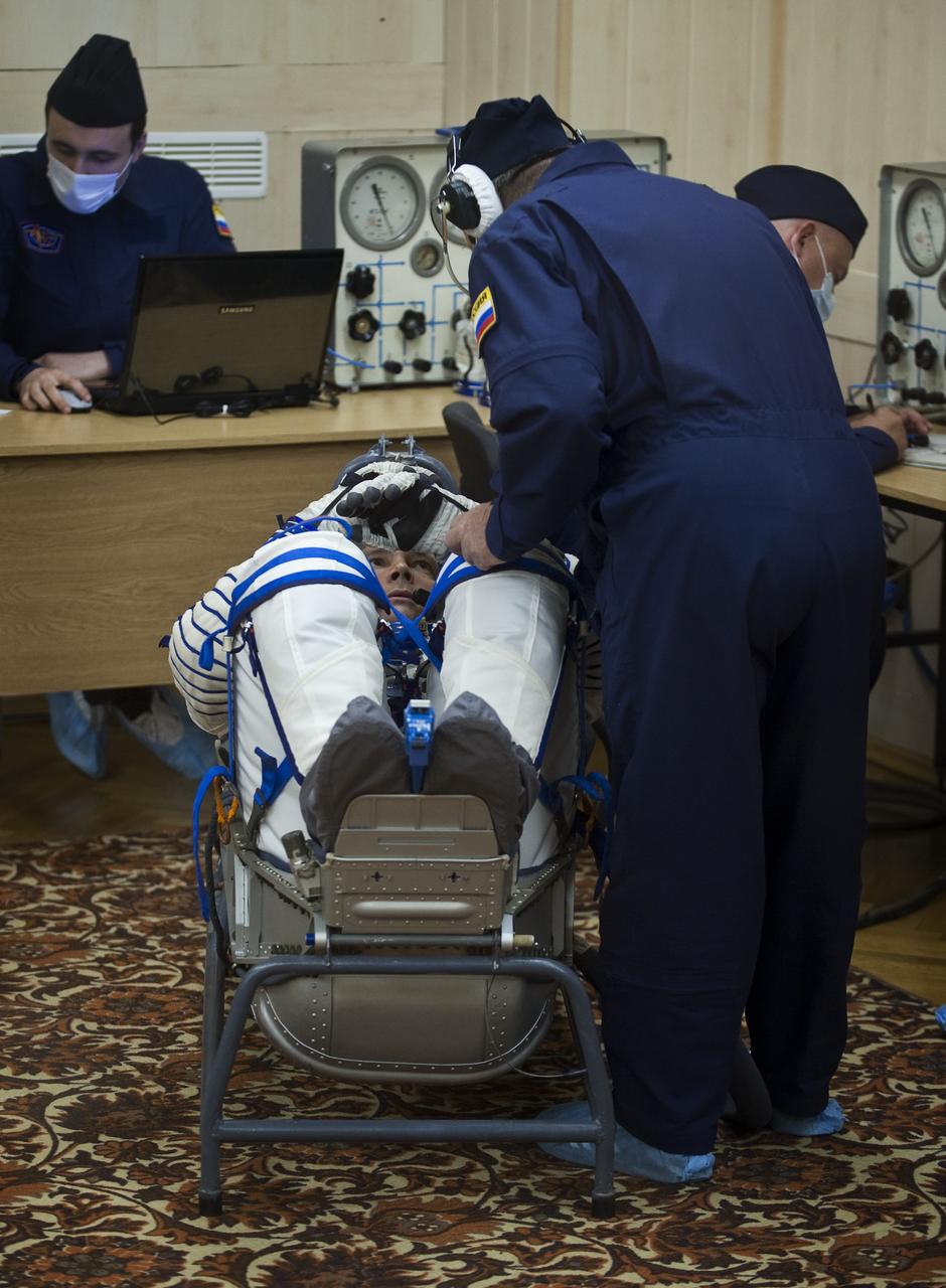 Expedition 24 Flight Engineer Doug Wheelock has his Russian Sokol suit pressure checked at the Baikonur Cosmodrome in Baikonur, Kazakhstan, Tuesday, June 15, 2010. Wheelock and fellow Expedition 24 crew members Flight Engineer Shannon Walker and Soyuz Commander Fyodor Yurchikhin launched in their Soyuz TMA-19 rocket from the Baikonur Cosmodrome in Kazakhstan on Wednesday, June 16, 2010 at 3:35 a.m. Kazakhstan time. (Photo Credit: NASA/Carla Cioffi)