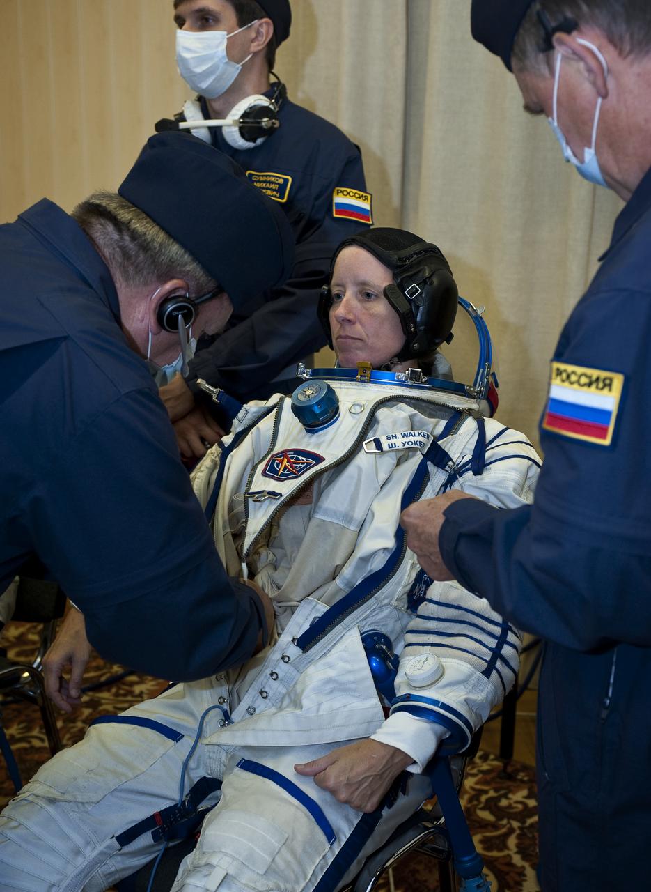 Expedition 24 NASA Flight Engineer Shannon Walker has her Russian Sokol suit prepared for launch by technicians at the Baikonur Cosmodrome in Baikonur, Kazakhstan, Tuesday, June 15, 2010. Walker, Soyuz Commander Fyodor Yurchikhin and Flight Engineer Doug Wheelock launched in their Soyuz TMA-19 rocket from the Baikonur Cosmodrome in Kazakhstan on Wednesday, June 16, 2010. (Photo Credit: NASA/Carla Cioffi)