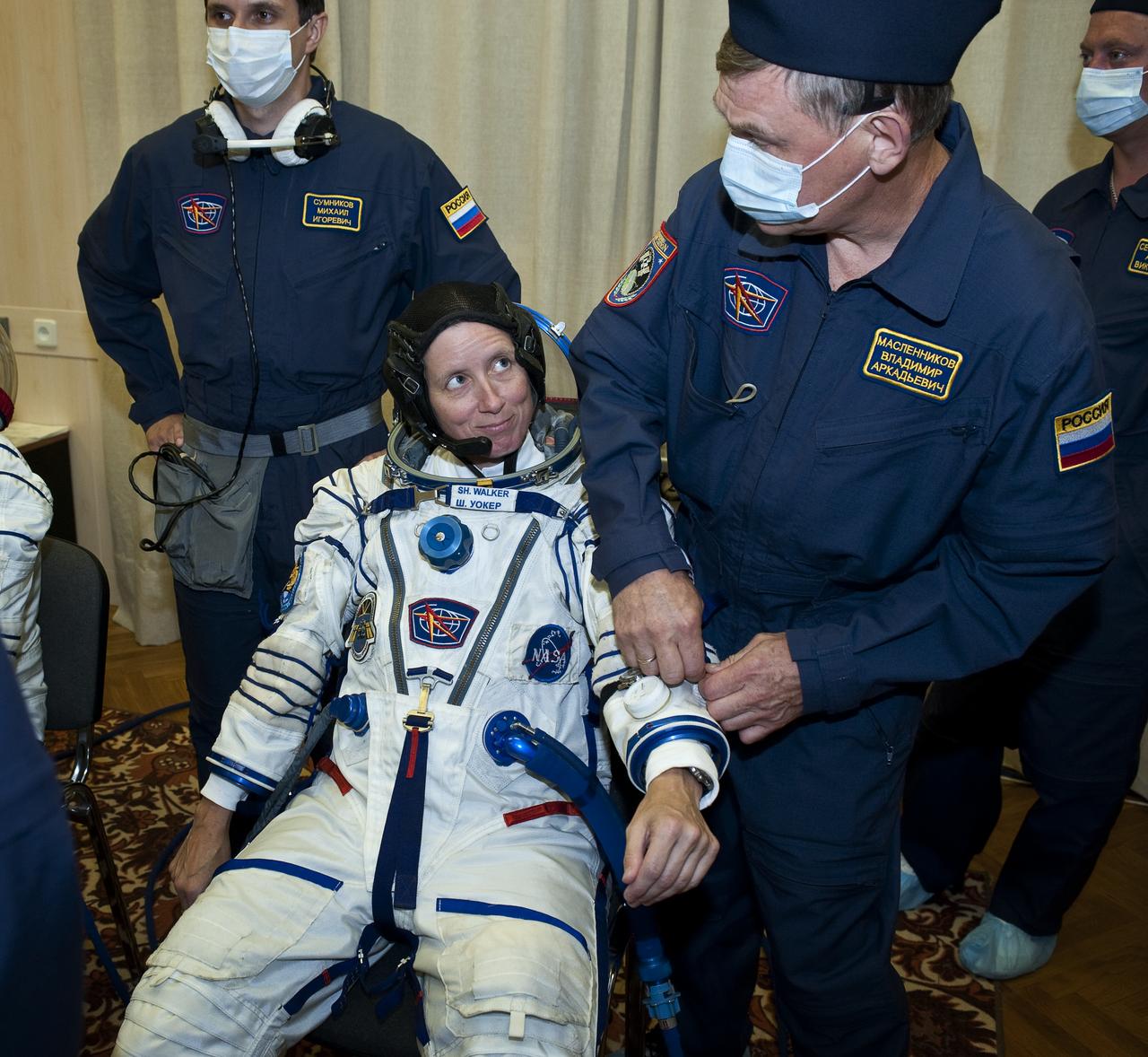 Expedition 24 NASA Flight Engineer Shannon Walker has her Russian Sokol suit prepared for launch by technicians at the Baikonur Cosmodrome in Baikonur, Kazakhstan, Tuesday, June 15, 2010. Walker, Soyuz Commander Fyodor Yurchikhin and Flight Engineer Doug Wheelock launched in their Soyuz TMA-19 rocket from the Baikonur Cosmodrome in Kazakhstan on Wednesday, June 16, 2010. (Photo Credit: NASA/Carla Cioffi)