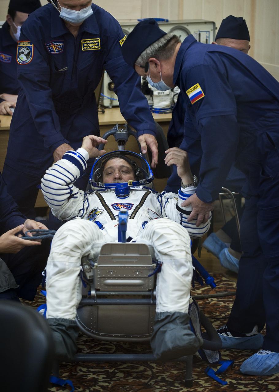 Expedition 24 Soyuz Commander Fyodor Yurchikhin has his Russian Sokol suit pressure checked at the Baikonur Cosmodrome in Baikonur, Kazakhstan, Tuesday, June 15, 2010. Yurchikhin and fellow Expedition 24 crew members, Flight Engineers Shannon Walker and Doug Wheelock launched in their Soyuz TMA-19 rocket from the Baikonur Cosmodrome in Kazakhstan on Wednesday, June 16, 2010 at 3:35 a.m. Kazakhstan time. (Photo Credit: NASA/Carla Cioffi)