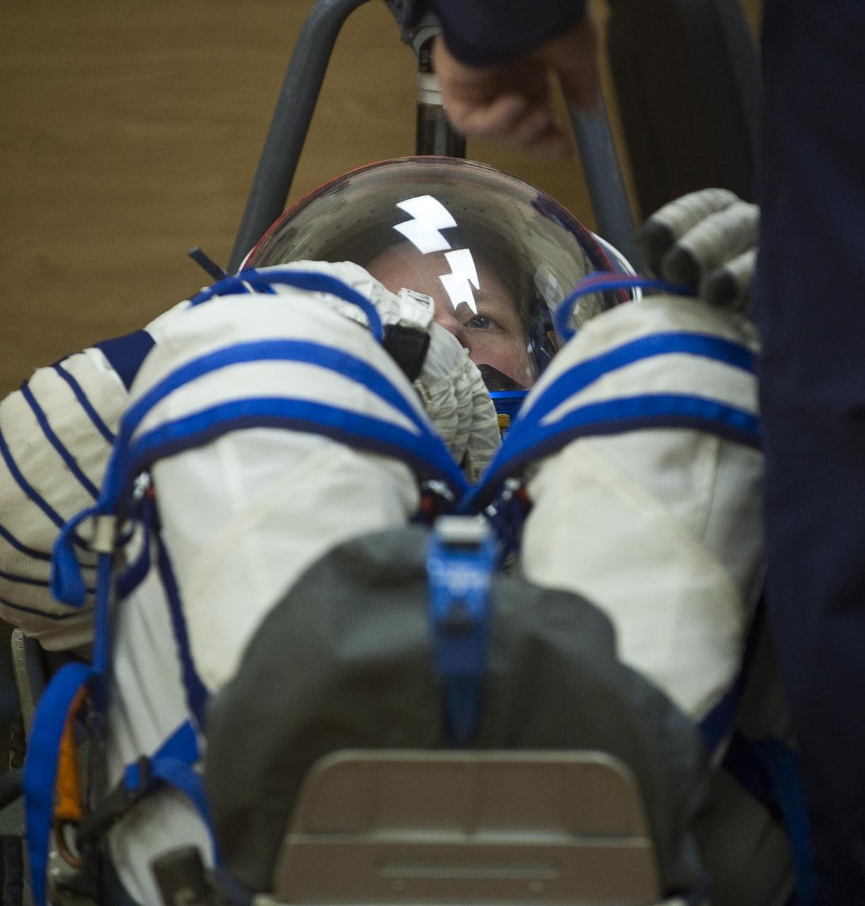 Expedition 24 Flight Engineer Shannon Walker has her Russian Sokol suit pressure checked at the Baikonur Cosmodrome in Baikonur, Kazakhstan, Tuesday, June 15, 2010. Walker and fellow Expedition 24 crew members Flight Engineers Doug Wheelock and Soyuz Commander Fyodor Yurchikhin launched in their Soyuz TMA-19 rocket from the Baikonur Cosmodrome in Kazakhstan on Wednesday, June 16, 2010 at 3:35 a.m. Kazakhstan time. (Photo Credit: NASA/Carla Cioffi)