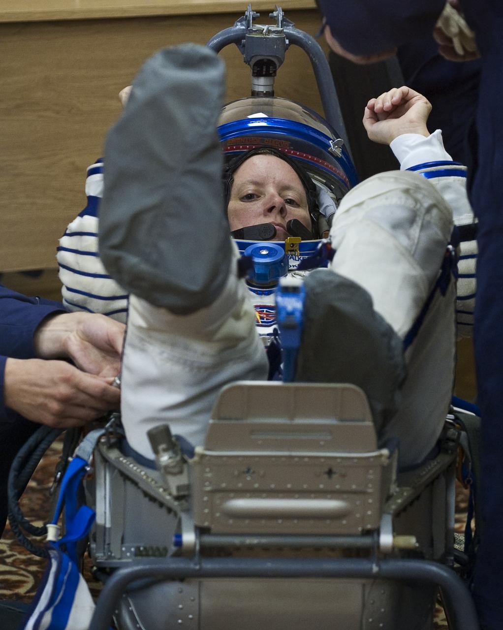Expedition 24 Flight Engineer Shannon Walker has her Russian Sokol suit pressure checked at the Baikonur Cosmodrome in Baikonur, Kazakhstan, Tuesday, June 15, 2010. Walker and fellow Expedition 24 crew members Flight Engineers Doug Wheelock and Soyuz Commander Fyodor Yurchikhin launched in their Soyuz TMA-19 rocket from the Baikonur Cosmodrome in Kazakhstan on Wednesday, June 16, 2010 at 3:35 a.m. Kazakhstan time. (Photo Credit: NASA/Carla Cioffi)