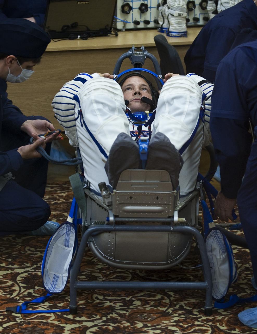 Expedition 24 Flight Engineer Doug Wheelock has his Russian Sokol suit pressure checked at the Baikonur Cosmodrome in Baikonur, Kazakhstan, Tuesday, June 15, 2010. Wheelock and fellow Expedition 24 crew members Flight Engineer Shannon Walker and Soyuz Commander Fyodor Yurchikhin launched in their Soyuz TMA-19 rocket from the Baikonur Cosmodrome in Kazakhstan on Wednesday, June 16, 2010 at 3:35 a.m. Kazakhstan time. (Photo Credit: NASA/Carla Cioffi)