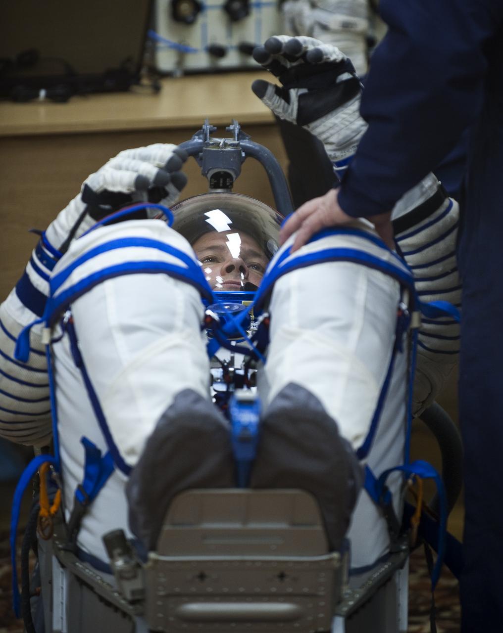 Expedition 24 Flight Engineer Doug Wheelock has his Russian Sokol suit pressure checked at the Baikonur Cosmodrome in Baikonur, Kazakhstan, Tuesday, June 15, 2010. Wheelock and fellow Expedition 24 crew members Flight Engineer Shannon Walker and Soyuz Commander Fyodor Yurchikhin launched in their Soyuz TMA-19 rocket from the Baikonur Cosmodrome in Kazakhstan on Wednesday, June 16, 2010 at 3:35 a.m. Kazakhstan time. (Photo Credit: NASA/Carla Cioffi)