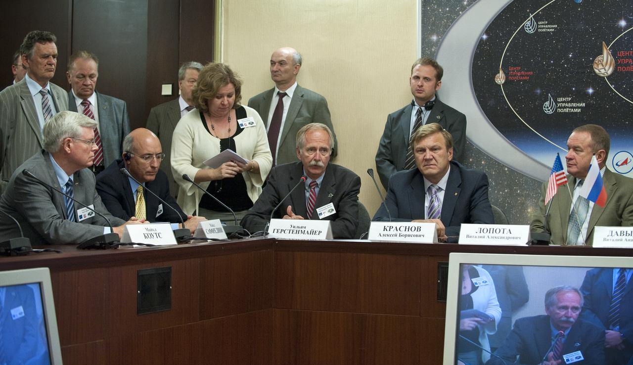 William Gerstenmaier, seated center, NASA Associate Administrator for Space Operations, speaks at a post Soyuz docking press conference at Russian Mission Control on Friday, June 18, 2010 in Korolev, Russia.  Gerstenmaier is seen with NASA and ROSCOSMOS senior management members.  Photo Credit: (NASA/Carla Cioffi)