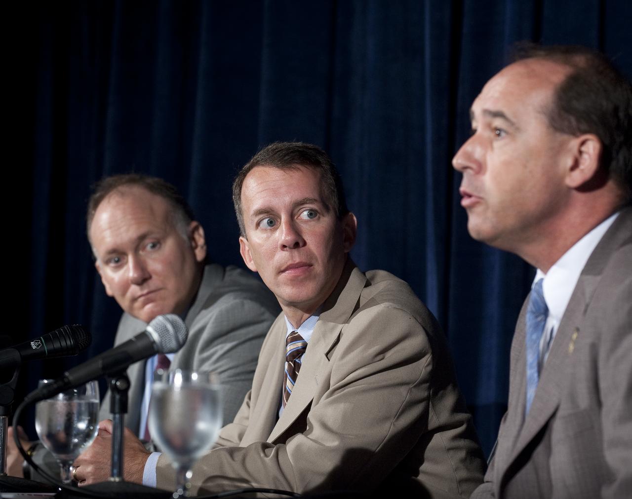 NASA Chief Technologist Bobby Braun, center, listens as NASA's Manager of Centennial Challenges Andy Petro, right, answers a reporter's question during a press conference held at the NASA New Space Technology Industry Forum being held at the University of Maryland in College Park on Tuesday, July 13, 2010.  During the two-day event, speakers are focusing on the president's fiscal year 2011 budget request for NASA's new Space Technology Program. Representatives from industry, academia and the federal government are in attendance to discuss strategy, development and implementation of NASA's proposed new technology-enabled exploration.  Photo Credit: (NASA/Bill Ingalls)
