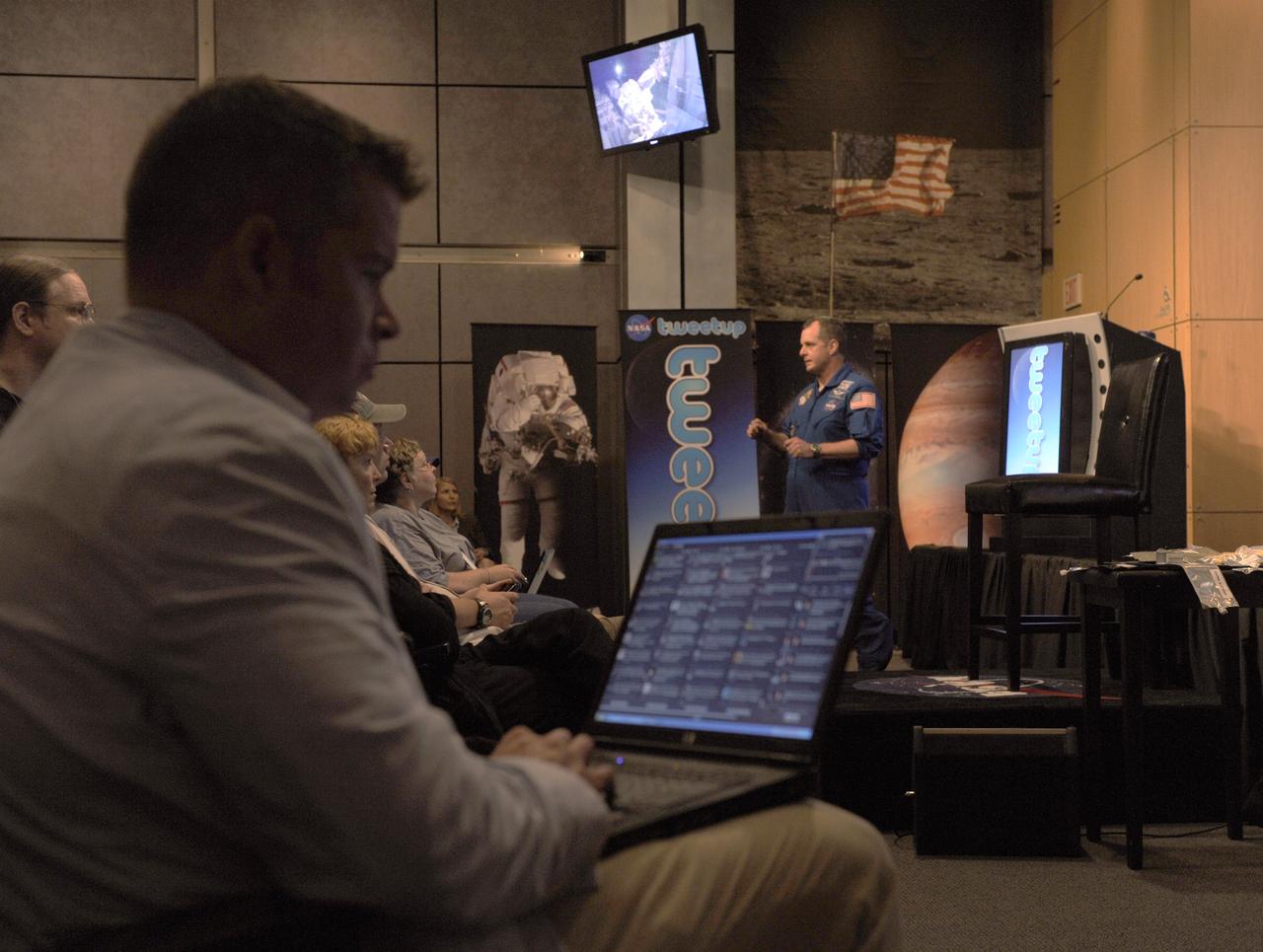 NASA astronaut TJ Creamer talks about his experience in space during a "Tweetup" at NASA Headquarters, Thursday, July 29, 2010, in Washington as Twitter followers looks on. Creamer, who spent 161 days living aboard the International Space Station as part of the Expedition 22/23 crew, set up the orbiting outpost's live Internet connection and posted updates about the mission to his Twitter account, sending the first live tweet from orbit. Photo Credit: (NASA/Paul E. Alers)