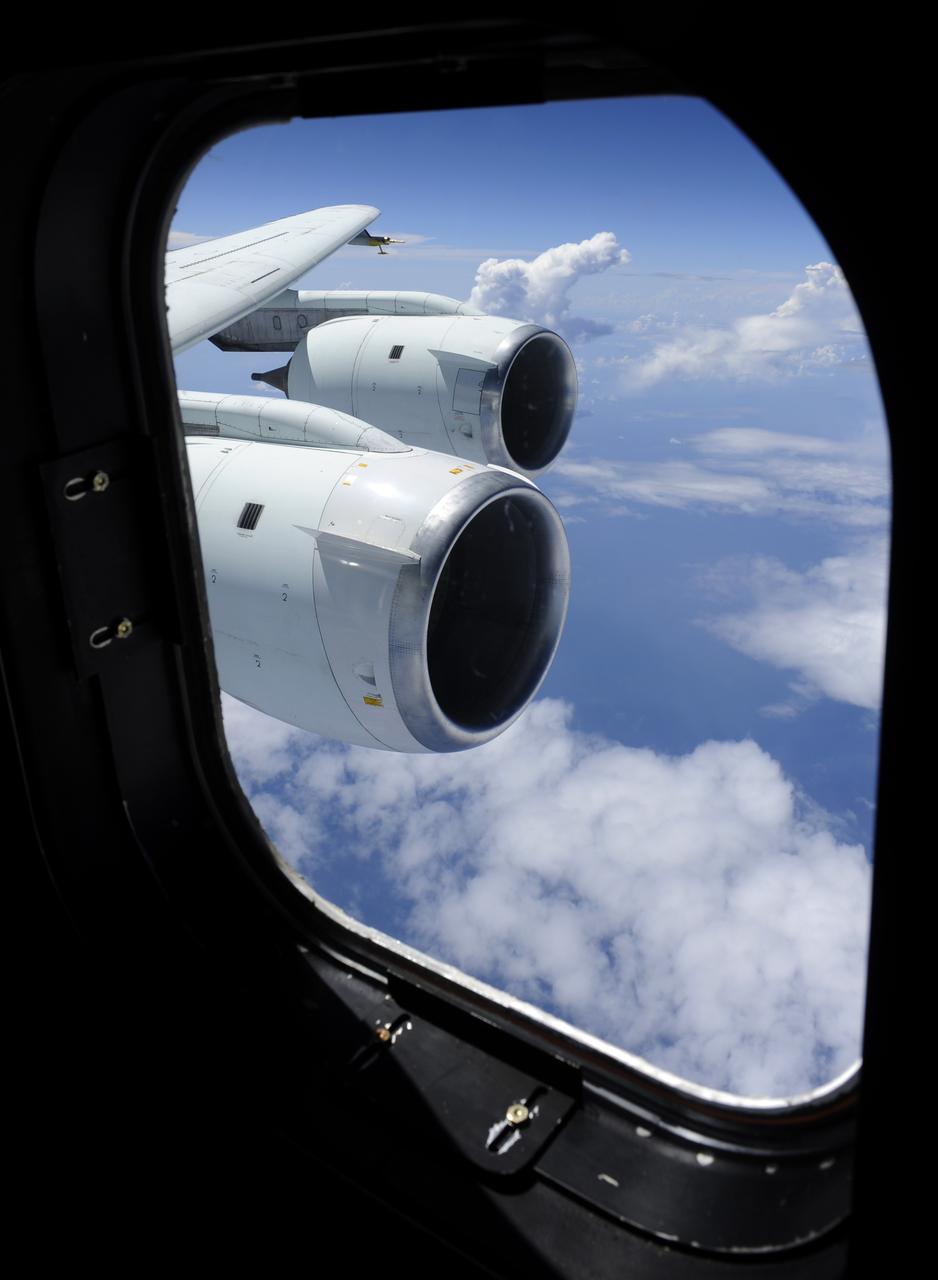 Cloud formations are seen through the window of NASA DC-8 aircraft during a flight, Tuesday, Aug. 17, 2010, over the Gulf of Mexico where researchers were studying weather patterns as part of trhe Genesis and Rapid Intensification Processes (GRIP) experiment,  a NASA Earth science field experiment in 2010 that is being conducted to better understand how tropical storms form and develop into major hurricanes. Photo Credit: (NASA/Paul E. Alers)