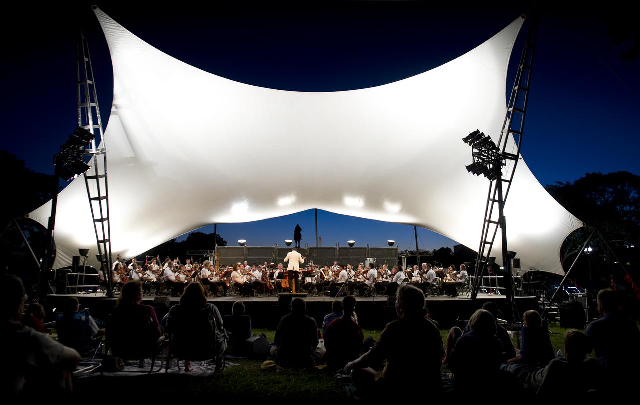 National Symphony Orchestra Conductor Emil de Cou leads the National Symphony Orchestra during the Labor Day Weekend concert on the West Lawn of the U.S. Capitol, Sunday, September 5, 2010 in Washington. NASA Administrator Charles Bolden joined the Orchestra to introduce one the program's segments, music from the film "Apollo 13". Photo Credit: (NASA/Bill Ingalls)