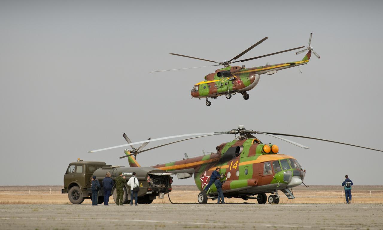 Russian search and rescue helicopters refuel in Arkalyk, Kazakhstan prior to the landing of the Soyuz TMA-18 spacecraft with Expedition 24 Commander Alexander Skvortsov and Flight Engineers Tracy Caldwell Dyson and Mikhail Kornienko on Saturday, Sept. 25, 2010. Russian Cosmonauts Skvortsov and Kornienko and NASA Astronaut Caldwell Dyson, are returning from six months onboard the International Space Station where they served as members of the Expedition 23 and 24 crews. Photo Credit: (NASA/Bill Ingalls)