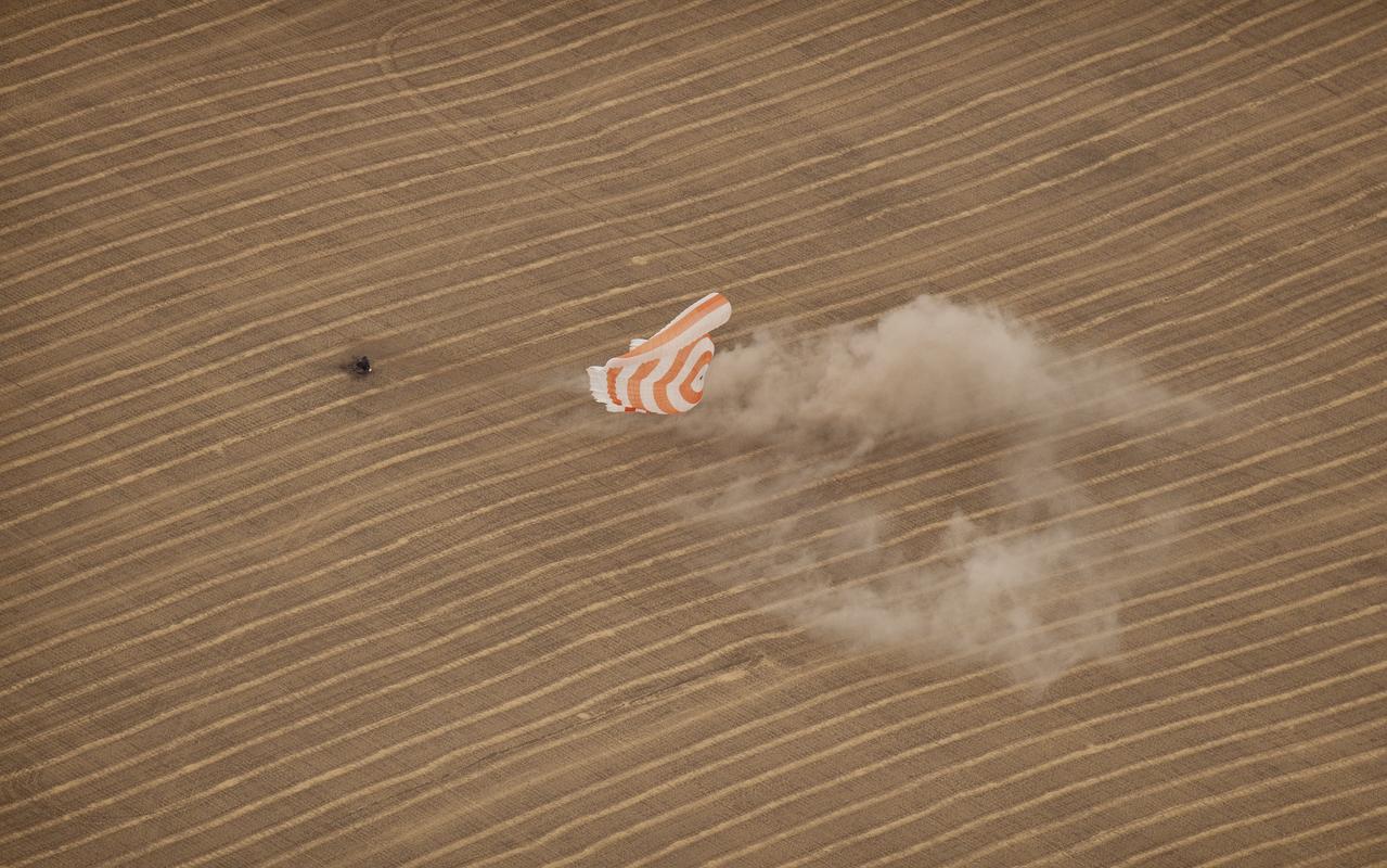 The Soyuz TMA-18 spacecraft is seen as it lands with Expedition 24 Commander Alexander Skvortsov and Flight Engineers Tracy Caldwell Dyson and Mikhail Kornienko near the town of Arkalyk, Kazakhstan on Saturday, Sept. 25, 2010. Russian Cosmonauts Skvortsov and Kornienko and NASA Astronaut Caldwell Dyson, are returning from six months onboard the International Space Station where they served as members of the Expedition 23 and 24 crews. Photo Credit: (NASA/Bill Ingalls)