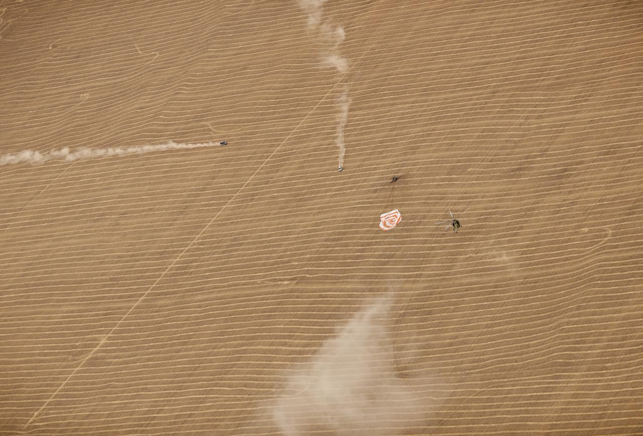 Russian search and rescue teams arrive at the landing site seconds after the Soyuz TMA-18 spacecraft touched down with Expedition 24 Commander Alexander Skvortsov and Flight Engineers Tracy Caldwell Dyson and Mikhail Kornienko near the town of Arkalyk, Kazakhstan on Saturday, Sept. 25, 2010. Russian Cosmonauts Skvortsov and Kornienko and NASA Astronaut Caldwell Dyson, are returning from six months onboard the International Space Station where they served as members of the Expedition 23 and 24 crews. Photo Credit: (NASA/Bill Ingalls)