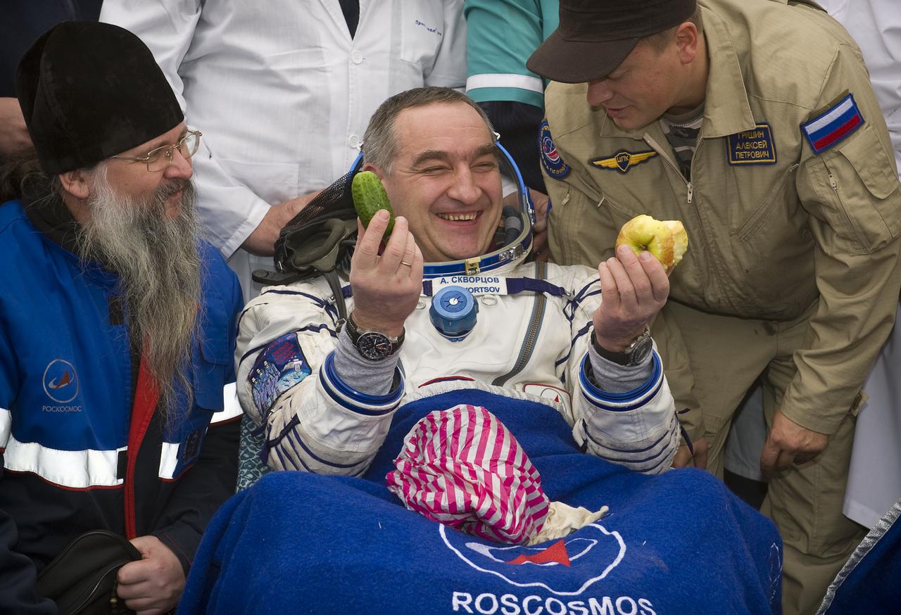 Expedition 24 Commander Alexander Skvortsov laughs after being given fresh fruit and vegetables shortly after landing in the Soyuz TMA-18 spacecraft with fellow crew members Tracy Caldwell Dyson and Mikhail Kornienko near the town of Arkalyk, Kazakhstan on Saturday, Sept. 25, 2010. Russian Cosmonauts Skvortsov and Kornienko and NASA Astronaut Caldwell Dyson, are returning from six months onboard the International Space Station where they served as members of the Expedition 23 and 24 crews. Photo Credit: (NASA/Bill Ingalls)