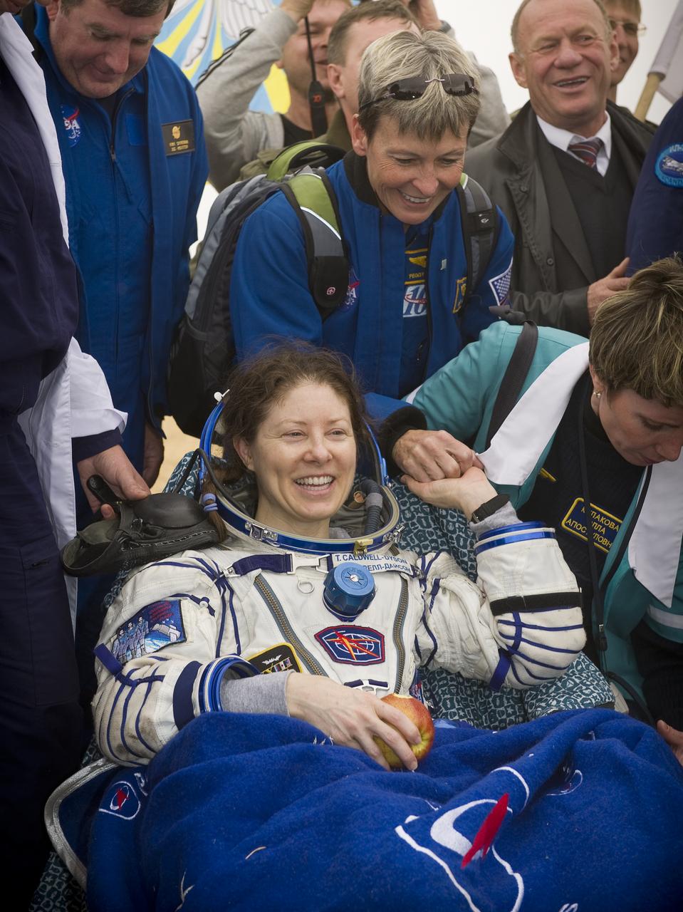 Expedition 24 Flight Engineer Tracy Caldwell Dyson shakes hands with NASA Astronaut and Chief of the Astronaut Office Peggy Whitson shortly after landing in the Soyuz TMA-18 spacecraft with fellow crew members Commander Alexander Skvortsov and Mikhail Kornienko near the town of Arkalyk, Kazakhstan on Saturday, Sept. 25, 2010. Russian Cosmonauts Skvortsov and Kornienko and NASA Astronaut Caldwell Dyson, are returning from six months onboard the International Space Station where they served as members of the Expedition 23 and 24 crews. Photo Credit: (NASA/Bill Ingalls)