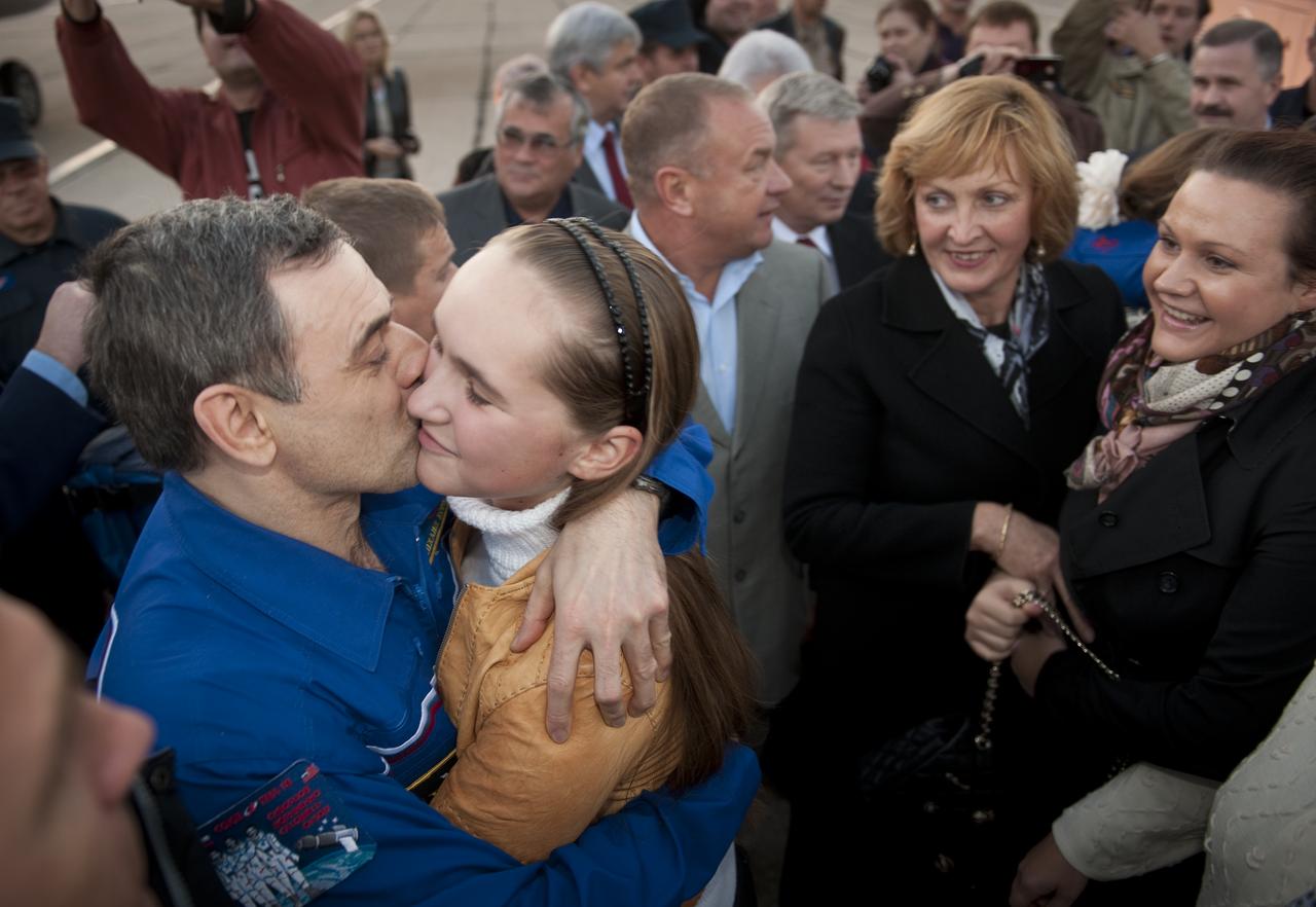 Expedition 24 Flight Engineer Mikhail Kornienko, embraces his family after he and Expedition 24 Commander Alexander Skvortsov arrived at Chkalovskaya airport just outside Moscow on Saturday, Sept. 25, 2010. Skvortsov, Kornienko and Expedition 24 Flight Engineer Tracy Caldwell Dyson, landed in their Soyuz TMA-18 spacecraft near the town of Arkalyk, Kazakhstan on Saturday, Sept. 25, 2010.  Russian Cosmonauts Skvortsov and Kornienko and NASA Astronaut Caldwell Dyson, are returning from six months onboard the International Space Station where they served as members of the Expedition 23 and 24 crews. Photo Credit: (NASA/Bill Ingalls)