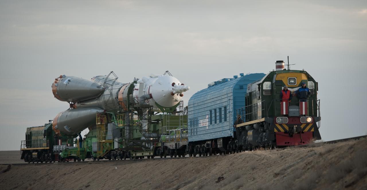 The Soyuz TMA-01M spacecraft is rolled out by train to the launch pad at the Baikonur Cosmodrome, Kazakhstan, Tuesday, Oct. 5, 2010.  The TMA-01M is a new modified Soyuz vehicle that features upgraded avionics and a digital cockpit display.  The crew of Expedition 25 Soyuz Commander Alexander Kaleri, NASA Flight Engineer Scott Kelly and Russian Flight Engineer Oleg Skripochka is scheduled for Friday, Oct. 8, 2010 at 5:10 a.m. Kazakhstan time.  Photo Credit (NASA/Carla Cioffi)