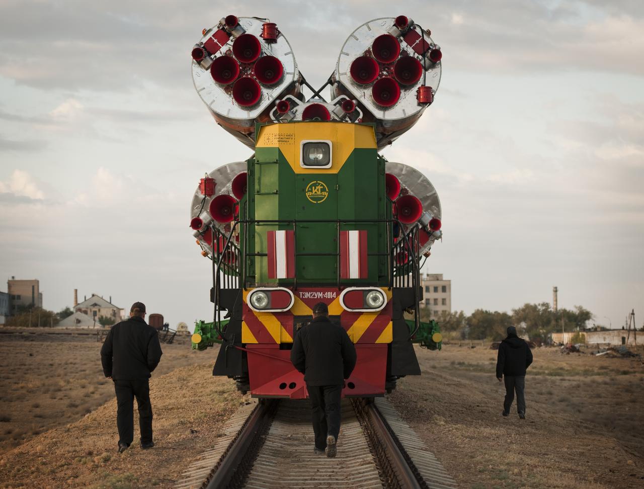 The Soyuz TMA-01M spacecraft is rolled out by train to the launch pad at the Baikonur Cosmodrome, Kazakhstan, Tuesday, Oct. 5, 2010.  The TMA-01M is a new modified Soyuz vehicle that features upgraded avionics and a digital cockpit display.  The crew of Expedition 25 Soyuz Commander Alexander Kaleri, NASA Flight Engineer Scott Kelly and Russian Flight Engineer Oleg Skripochka is scheduled for Friday, Oct. 8, 2010 at 5:10 a.m. Kazakhstan time.  Photo Credit (NASA/Carla Cioffi)