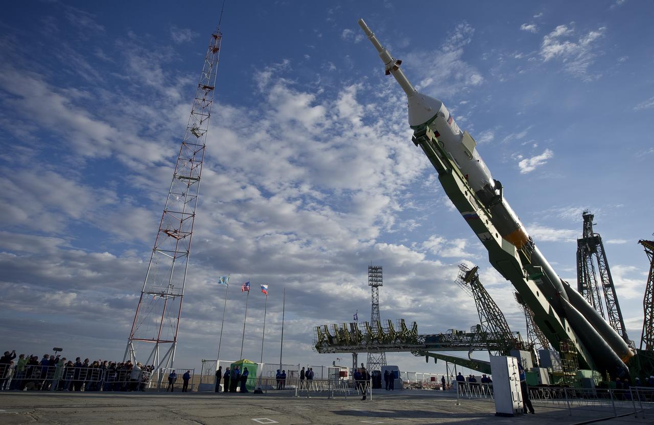 The Soyuz TMA-01M spacecraft is raised into vertical position at the launch pad of the Baikonur Cosmodrome, Kazakhstan, Tuesday, Oct. 5, 2010. The TMA-01M is a new modified Soyuz vehicle that features upgraded avionics and a digital cockpit display.  The crew of Expedition 25 Soyuz Commander Alexander Kaleri, NASA Flight Engineer Scott Kelly and Russian Flight Engineer Oleg Skripochka is scheduled for Friday, Oct. 8, 2010 at 5:10 a.m. Kazakhstan time.  Photo Credit: (NASA/Carla Cioffi)