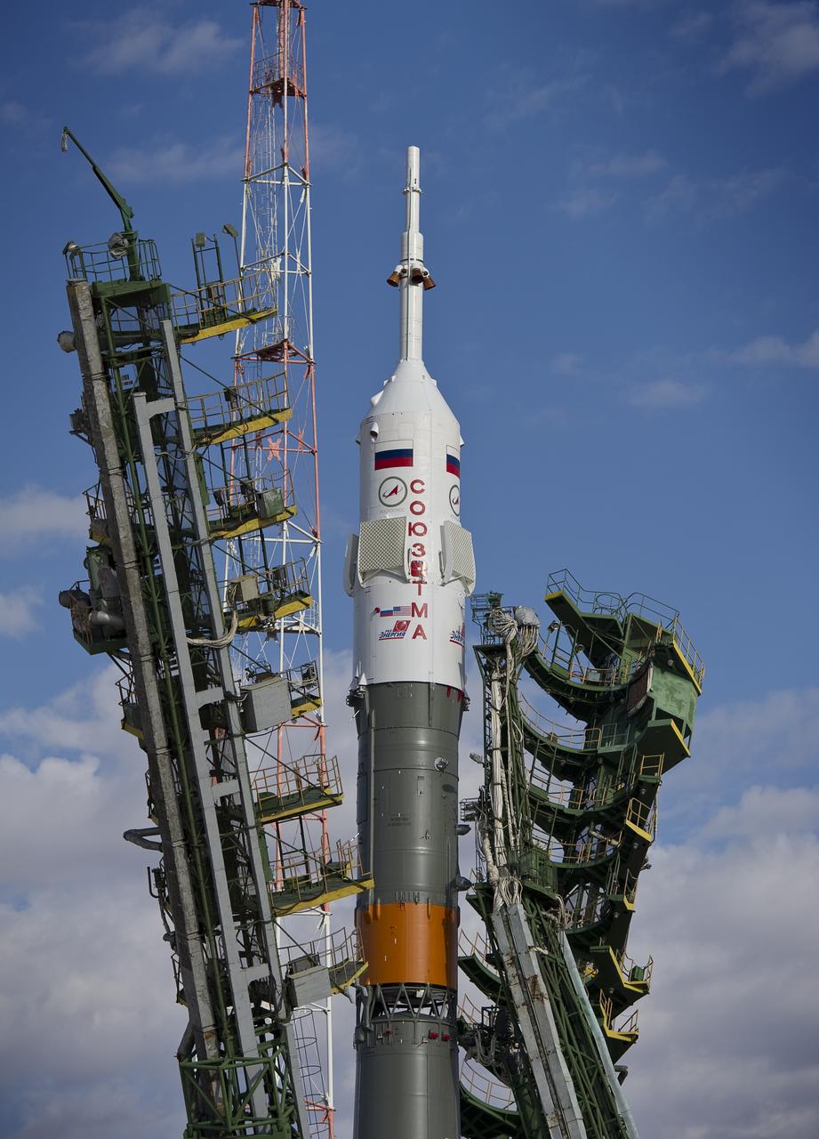 Launch scaffolding is raised into place around the Soyuz rocket shortly after arrival to the launch pad Tuesday, Oct. 5, 2010 at the Baikonur Cosmodrome in Kazakhstan.  The Soyuz TMA-01M is scheduled to launch the crew of Expedition 25 to the International Space Station on Friday, Oct. 8, 2010 at 5:10 a.m.  Photo Credit: (NASA/Carla Cioffi)