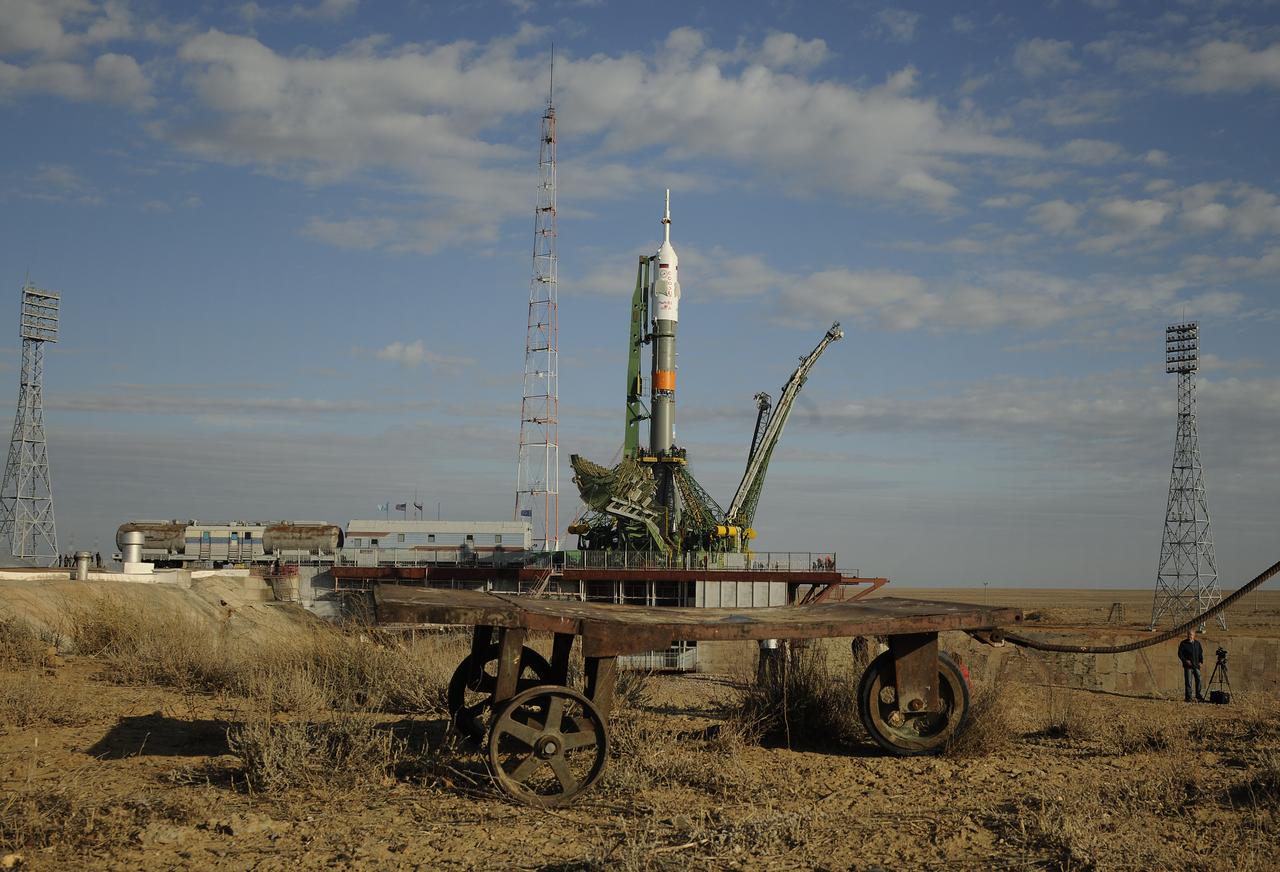 A cart is seen in front of the Soyuz TMA-01M spacecraft as it sits on the launch pad at the Baikonur Cosmodrome in Kazakhstan on Tuesday, Oct. 5, 2010.  The TMA-01M is scheduled to launch the crew of Expedition 25 to the International Space Station on Friday, Oct. 8 at 5:10 a.m. local time.  Photo Credit: (NASA/Carla Cioffi)